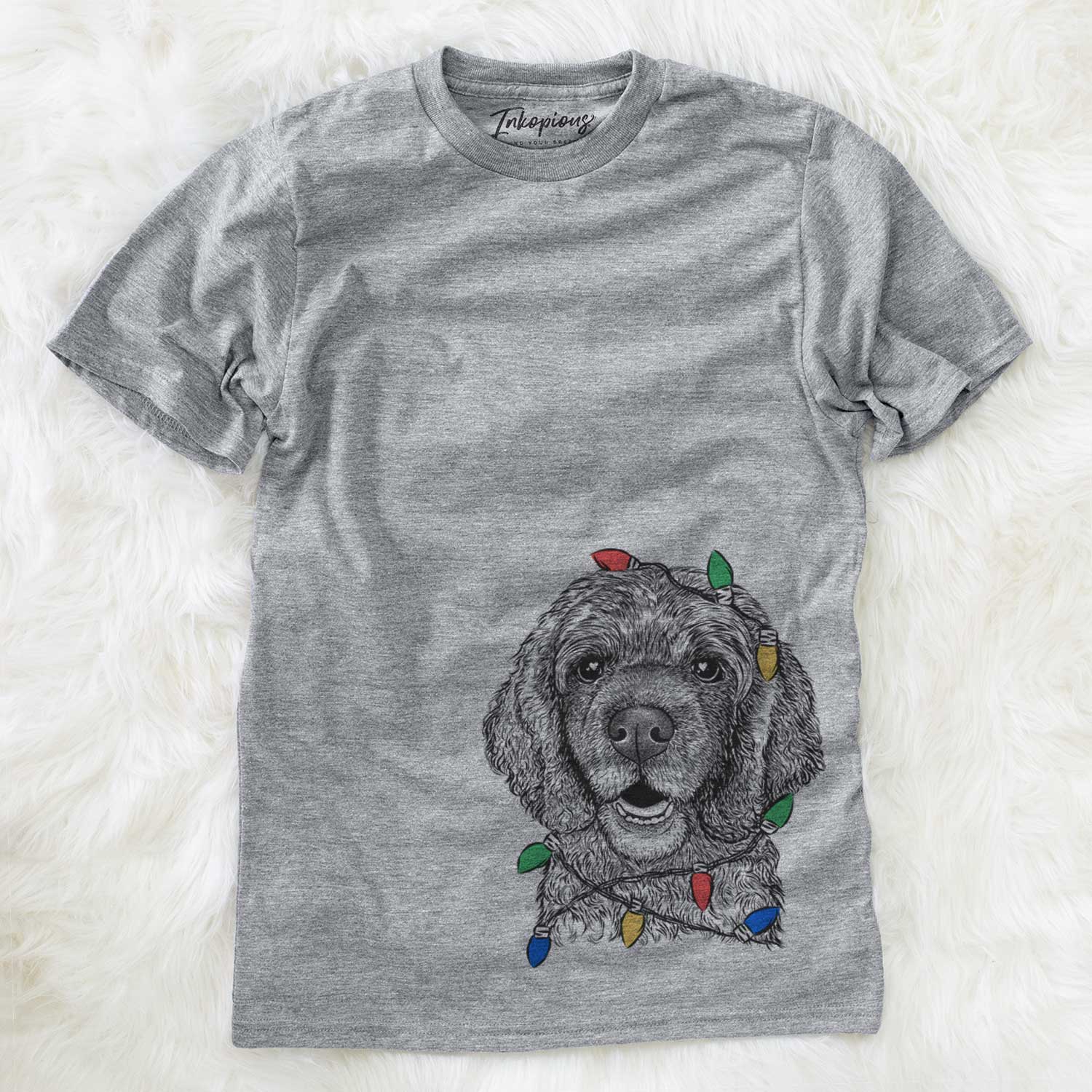 Hand-drawn sketch of Fannie Mae the Cocker Spaniel wrapped in Christmas lights on a Grey Unisex crewneck