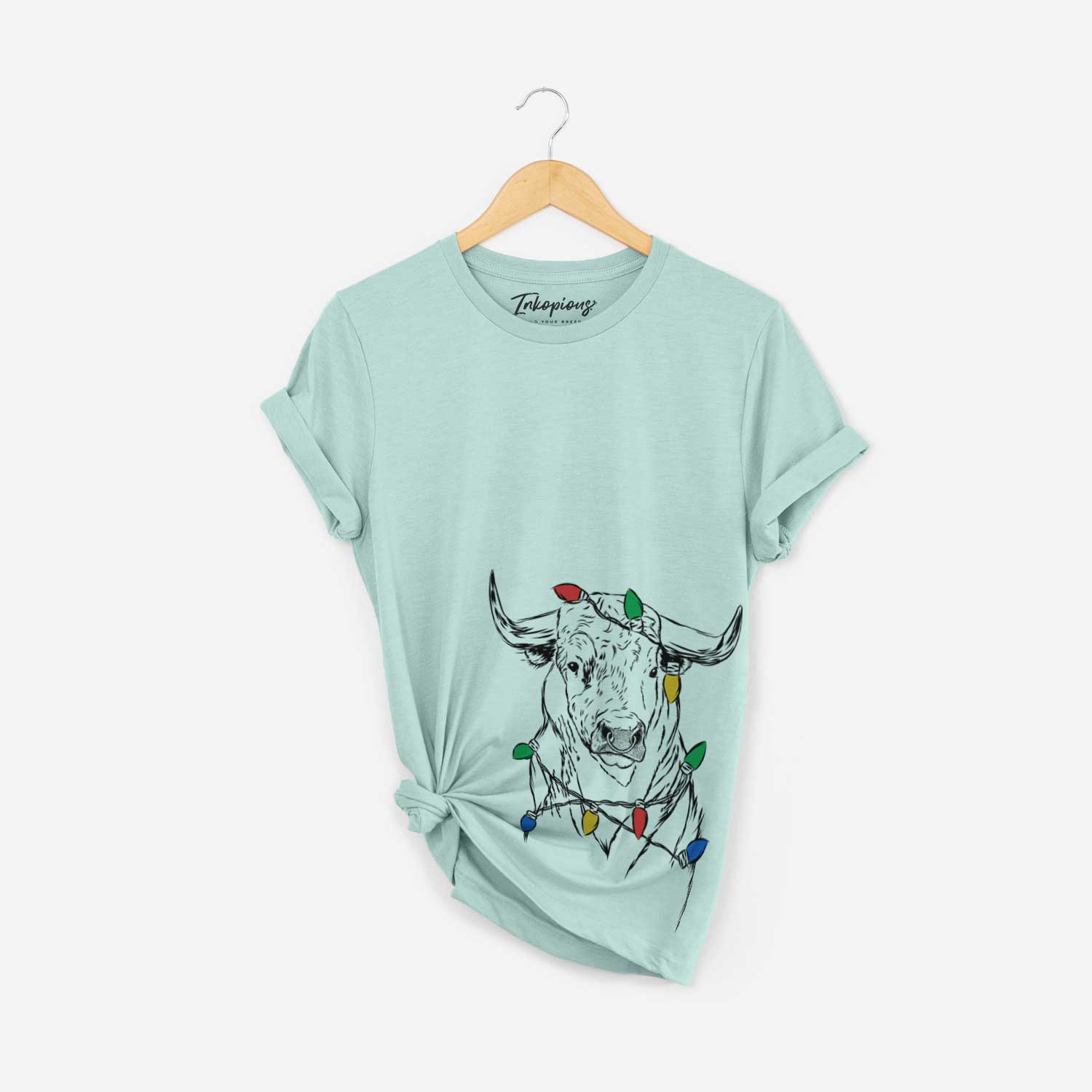 Hand-drawn sketch of Ferdinand the Bull wrapped in Christmas lights on a Heather Sage Unisex crewneck