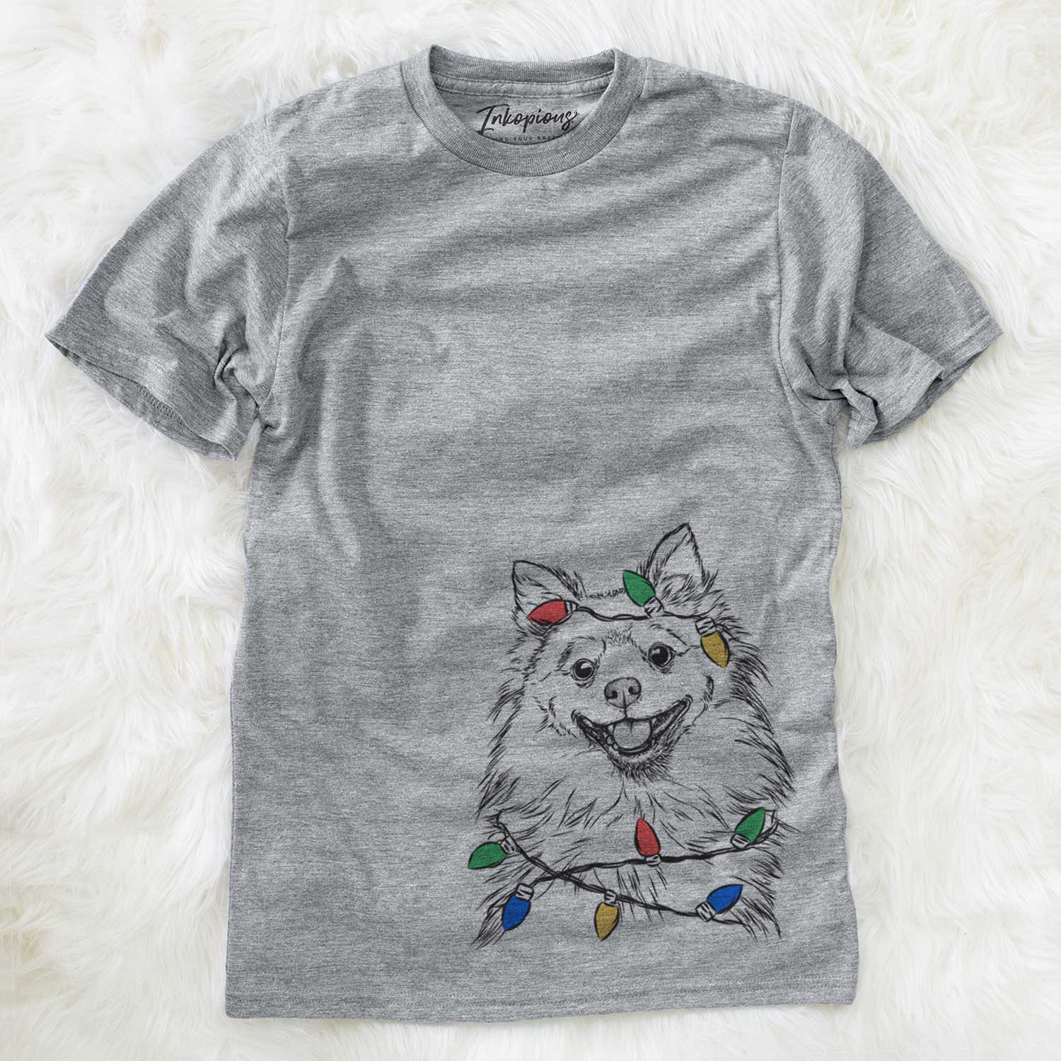 Hand-drawn sketch of Fibi the Spitz wrapped in Christmas lights on a Grey Unisex crewneck