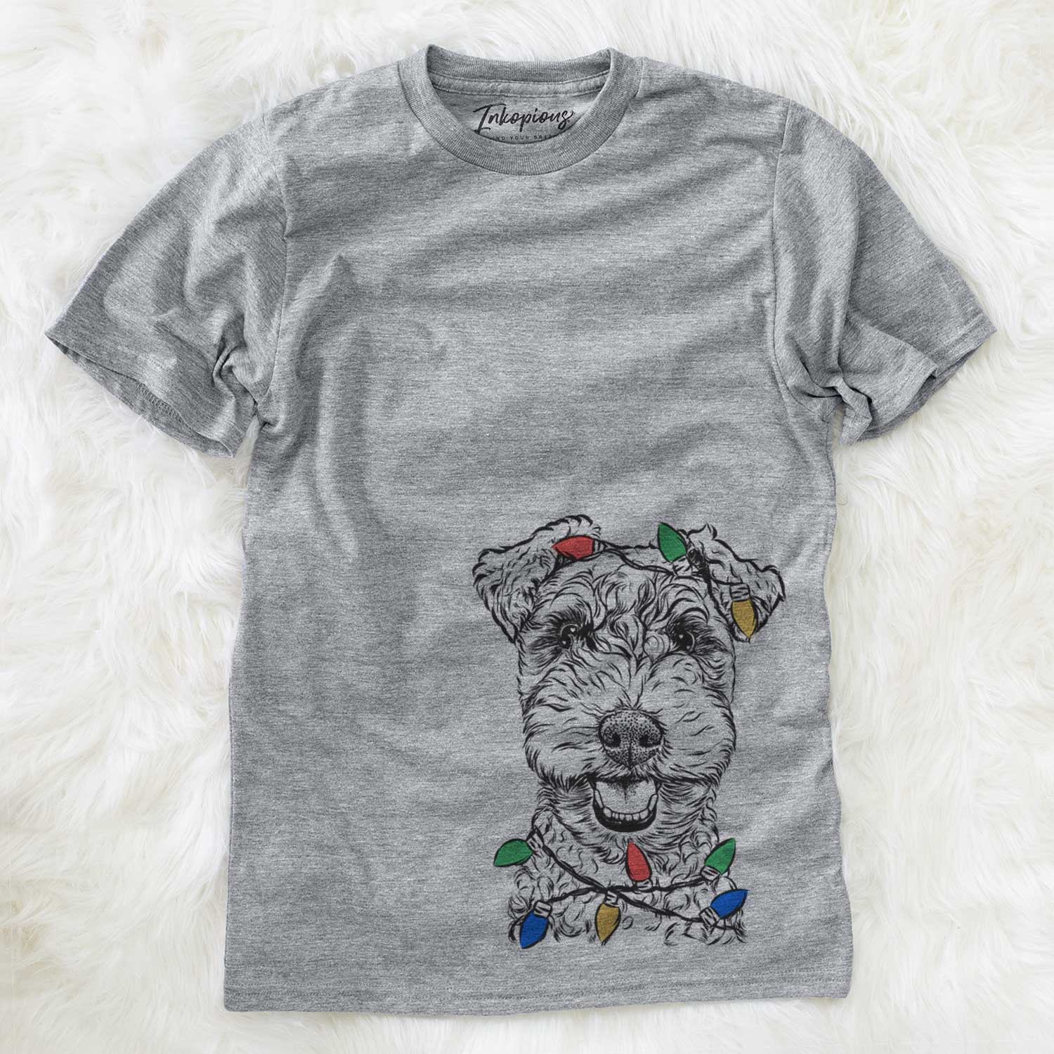 Hand-drawn sketch of Fintan the Irish Troodle wrapped in Christmas lights on a Grey Unisex crewneck