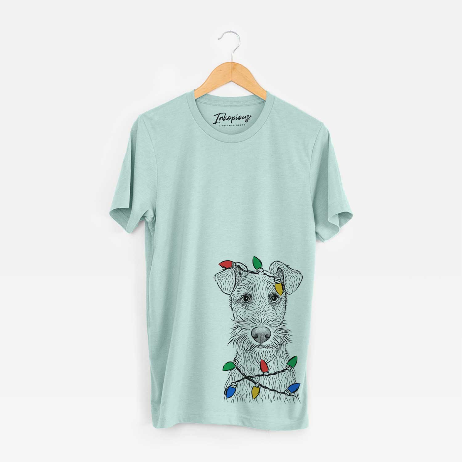 Hand-drawn sketch of Fitz the Wire Fox Terrier wrapped in Christmas lights on a Heather Sage Unisex crewneck