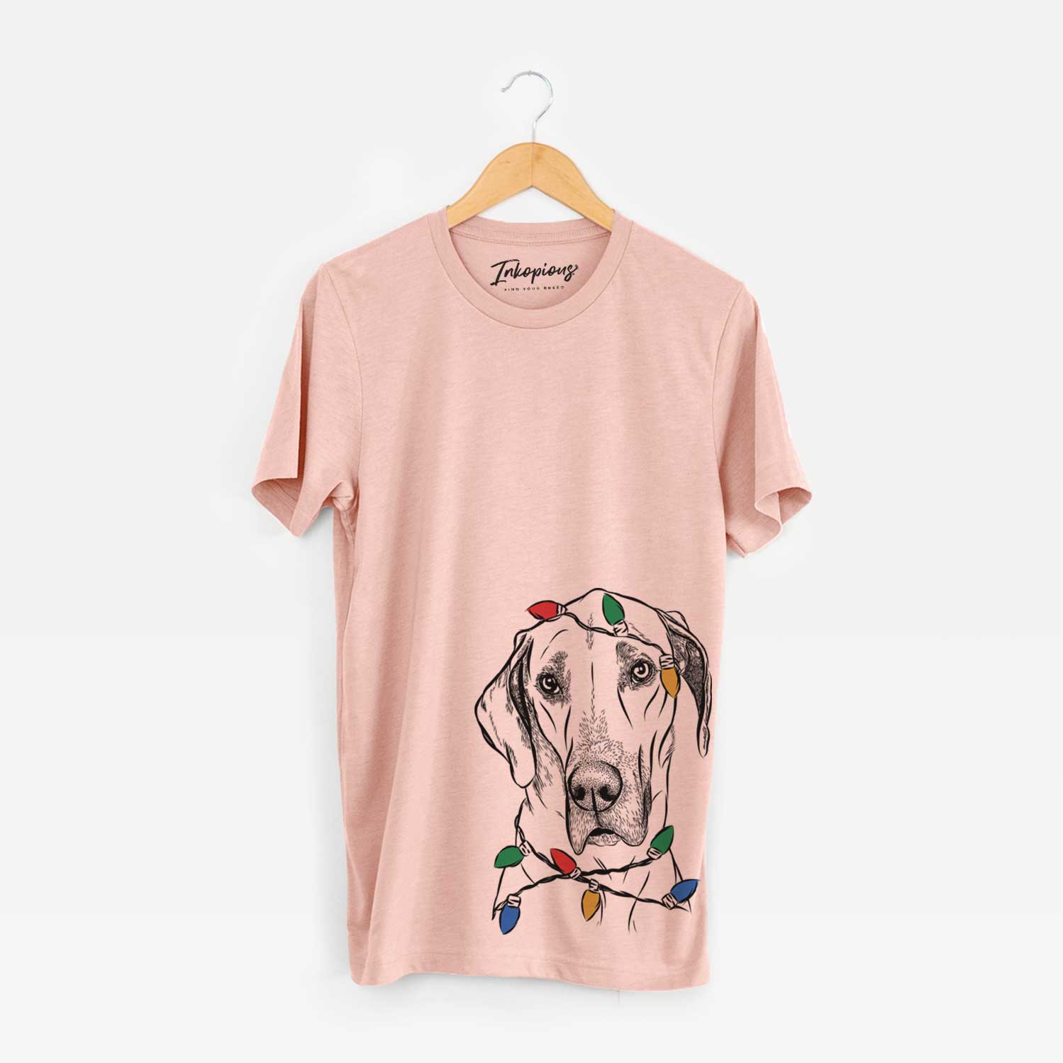 Hand-drawn sketch of Gracie the Great Dane wrapped in Christmas lights on a Peach Unisex crewneck