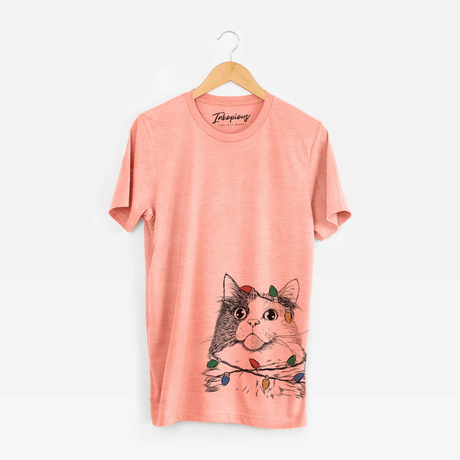 Hand-drawn sketch of Greta the Calico Cat wrapped in Christmas lights on a Sunset Unisex crewneck
