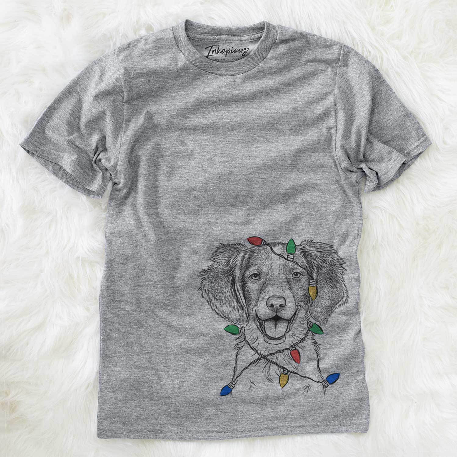 Hand-drawn sketch of Happy Holly the Brittany Spaniel wrapped in Christmas lights on a Grey Unisex crewneck