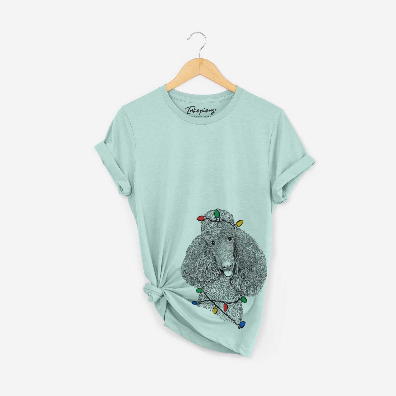Hand-drawn sketch of Henry the Standard Poodle wrapped in Christmas lights on a Heather Sage Unisex crewneck