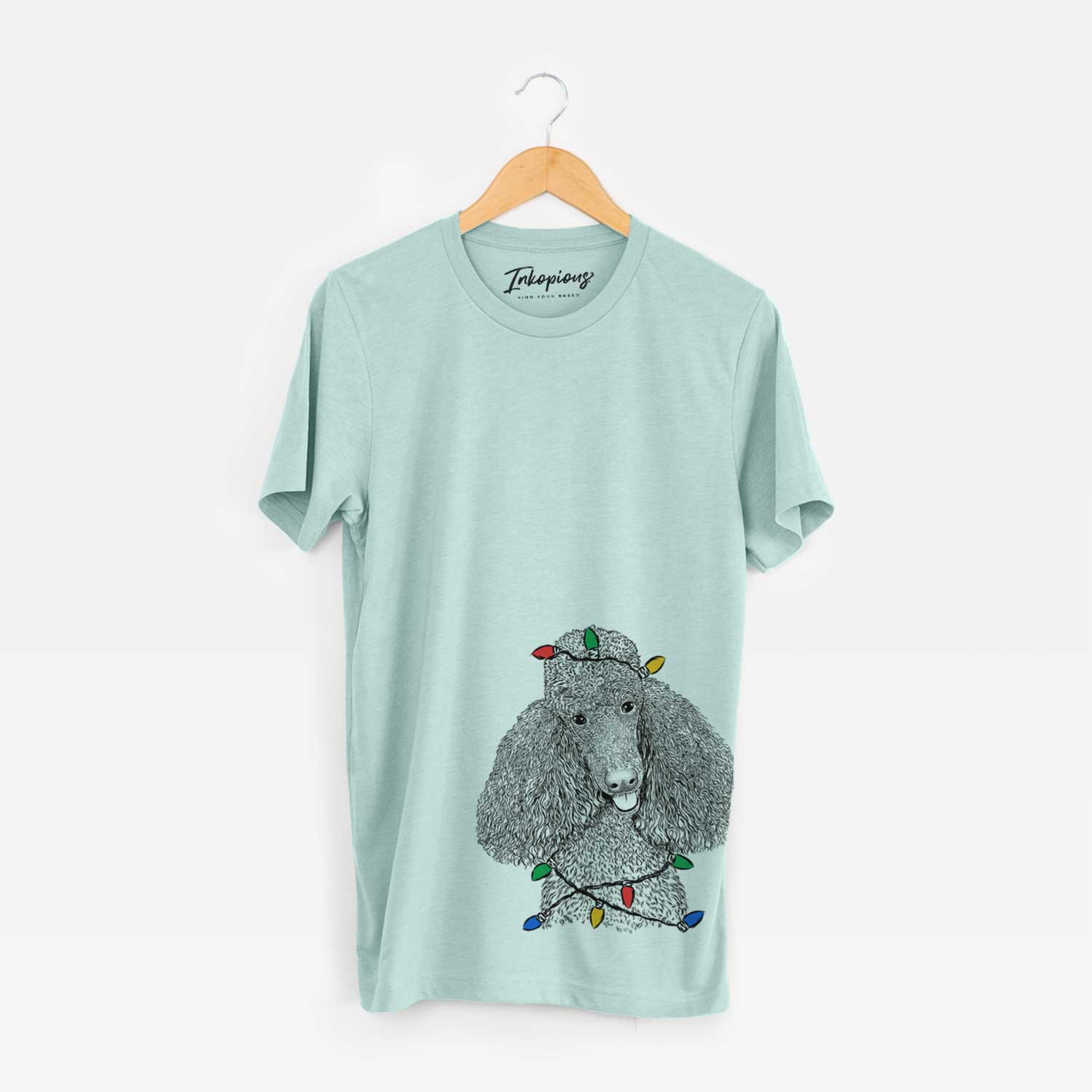 Hand-drawn sketch of Henry the Standard Poodle wrapped in Christmas lights on a Heather Sage Unisex crewneck