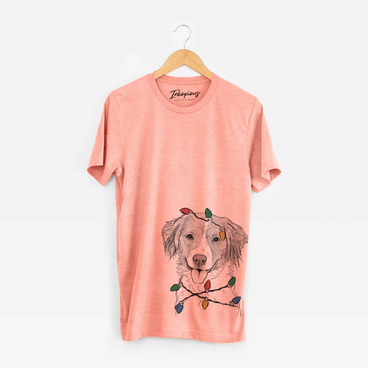 Hand-drawn sketch of Hercules the Nederlandse Kooikerhondje wrapped in Christmas lights on a Sunset Unisex crewneck