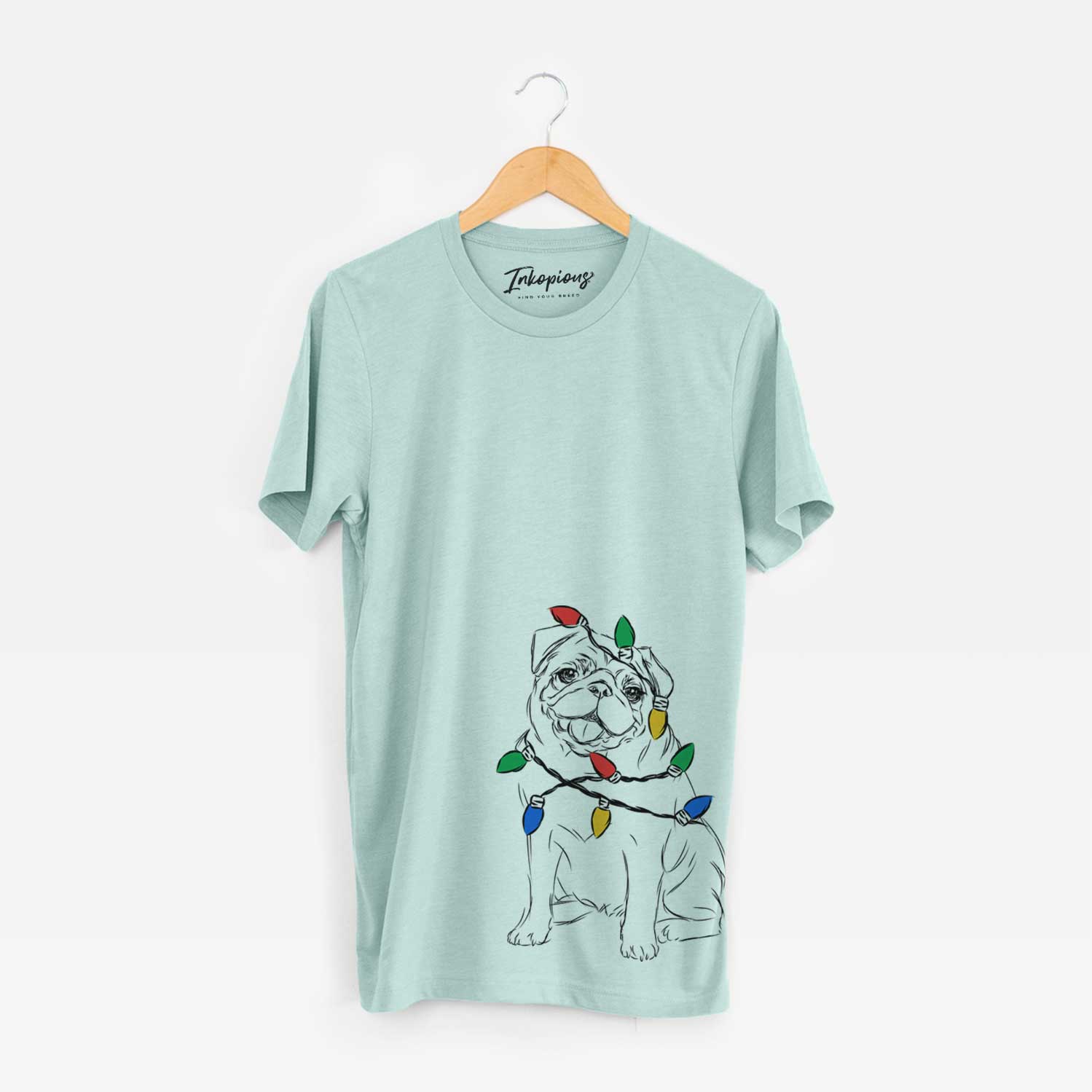 Hand-drawn sketch of Higgins the Pug wrapped in Christmas lights on a Heather Sage Unisex crewneck