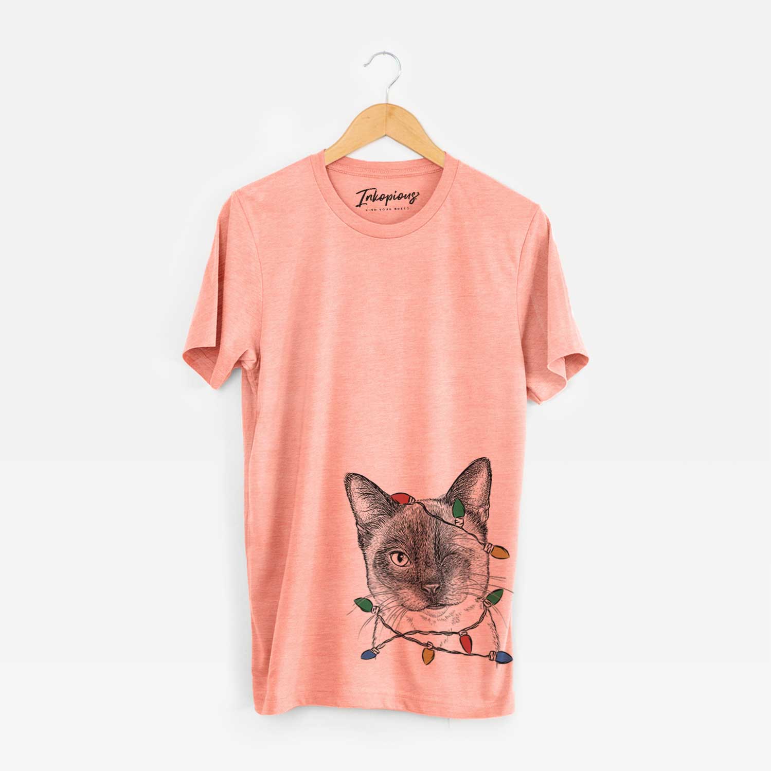 Hand-drawn sketch of Hoggle the Siamese Cat wrapped in Christmas lights on a Sunset Unisex crewneck