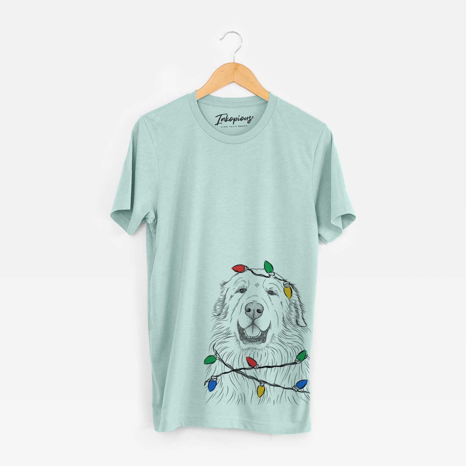 Hand-drawn sketch of Horton the Great Pyrenees wrapped in Christmas lights on a Heather Sage Unisex crewneck