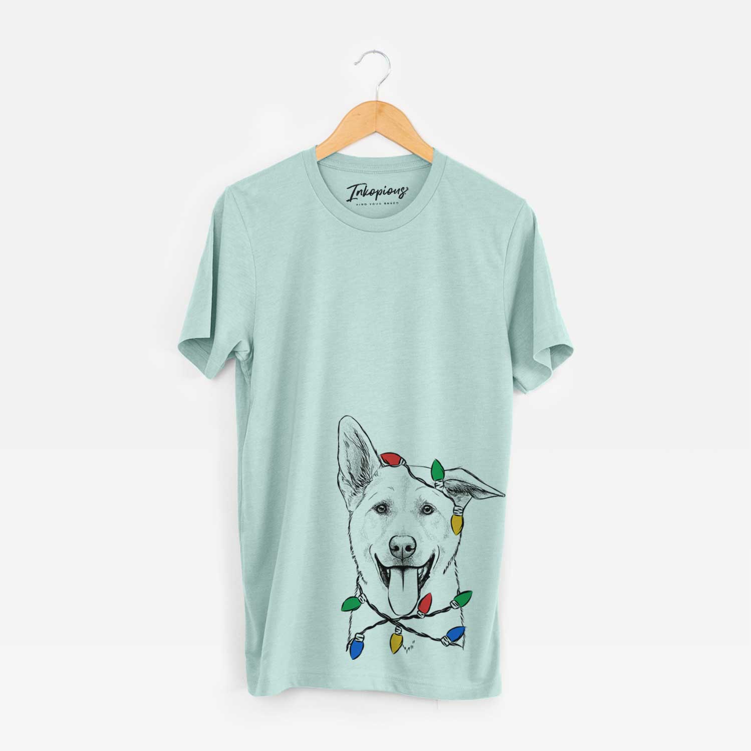 Hand-drawn sketch of Hoya the Korean Jindo wrapped in Christmas lights on a Heather Sage Unisex crewneck