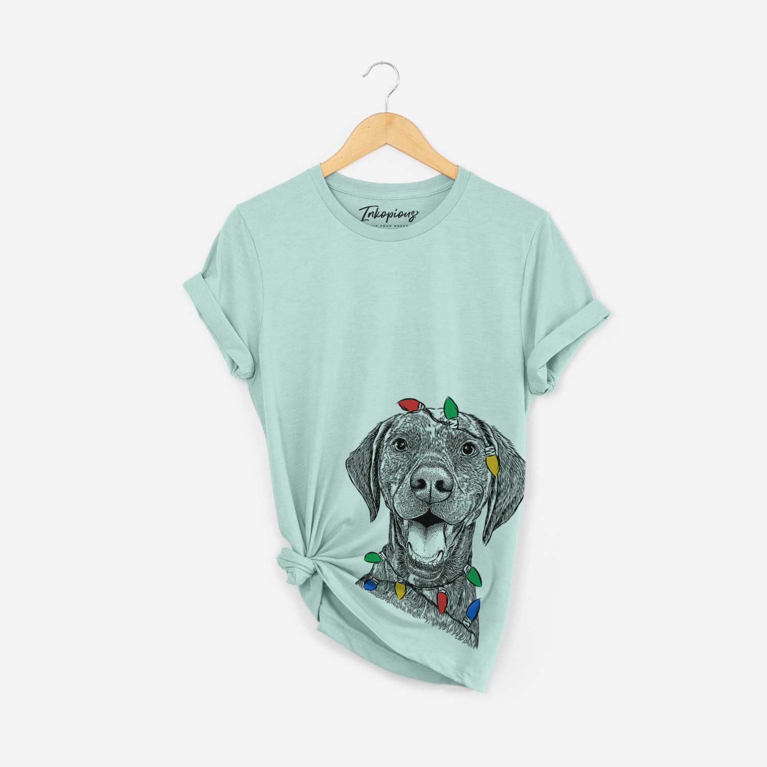 Hand-drawn sketch of Hudson the German Shorthaired Pointer wrapped in Christmas lights on a Heather Sage Unisex crewneck