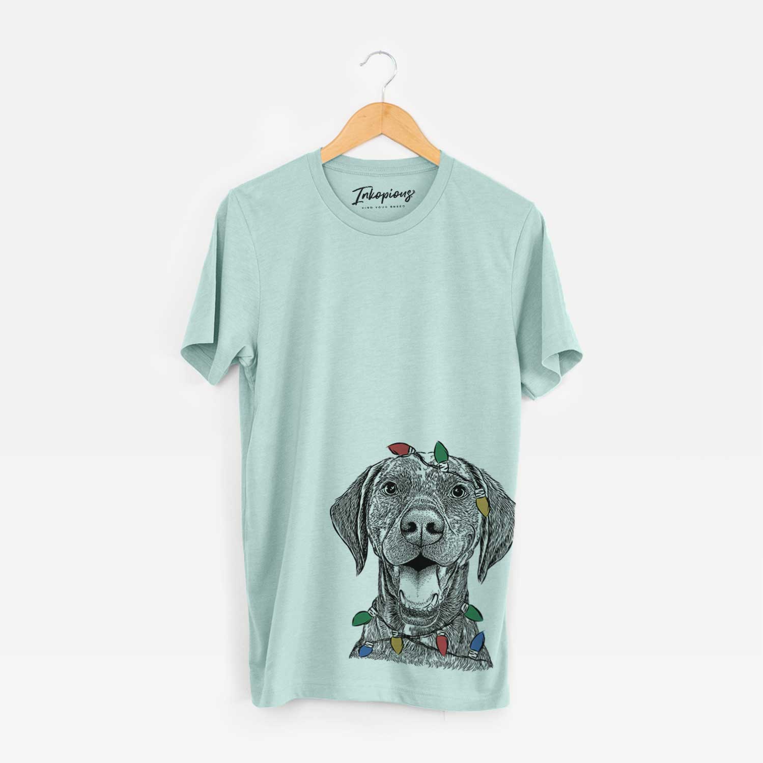 Hand-drawn sketch of Hudson the German Shorthaired Pointer wrapped in Christmas lights on a Heather Sage Unisex crewneck
