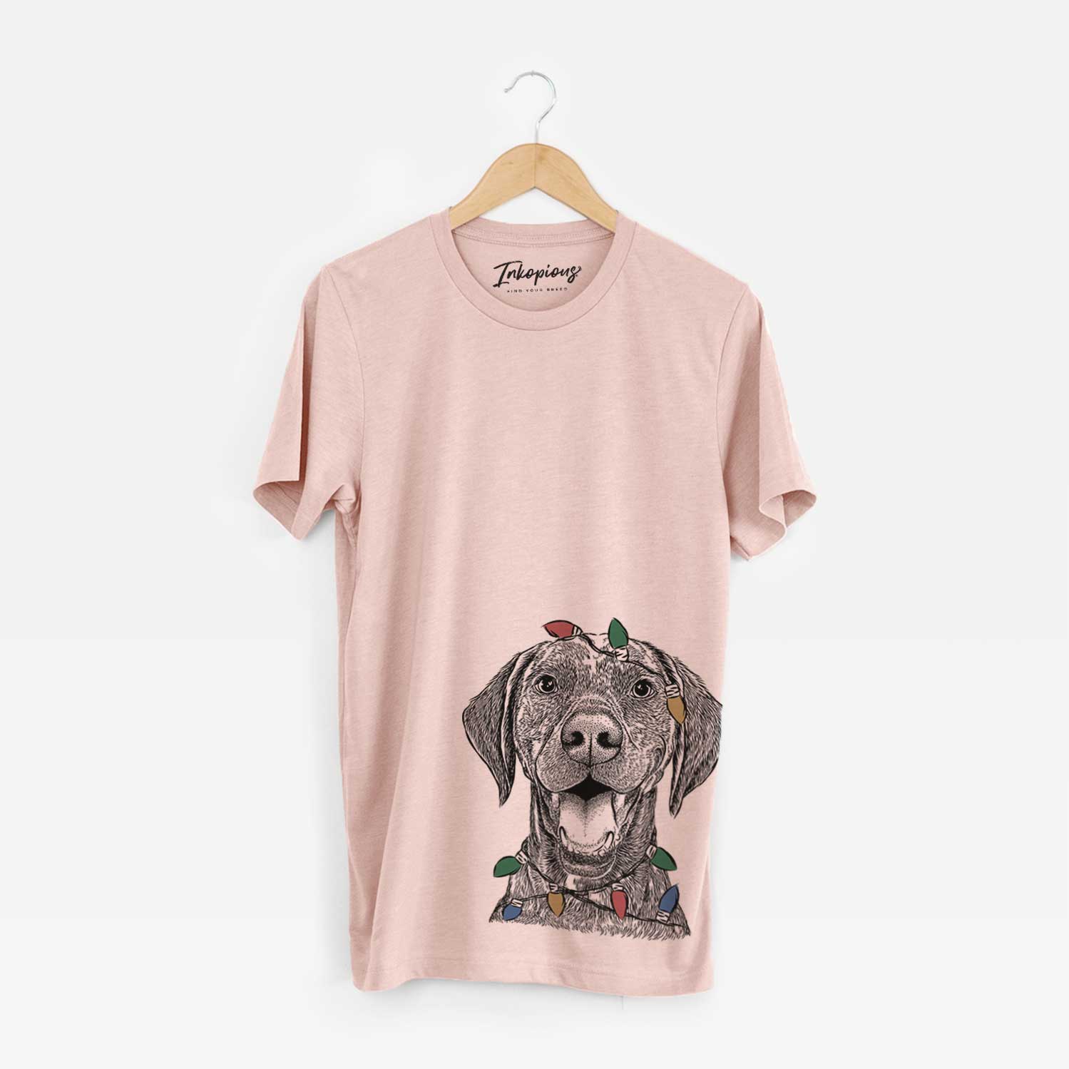 Hand-drawn sketch of Hudson the German Shorthaired Pointer wrapped in Christmas lights on a Peach Unisex crewneck