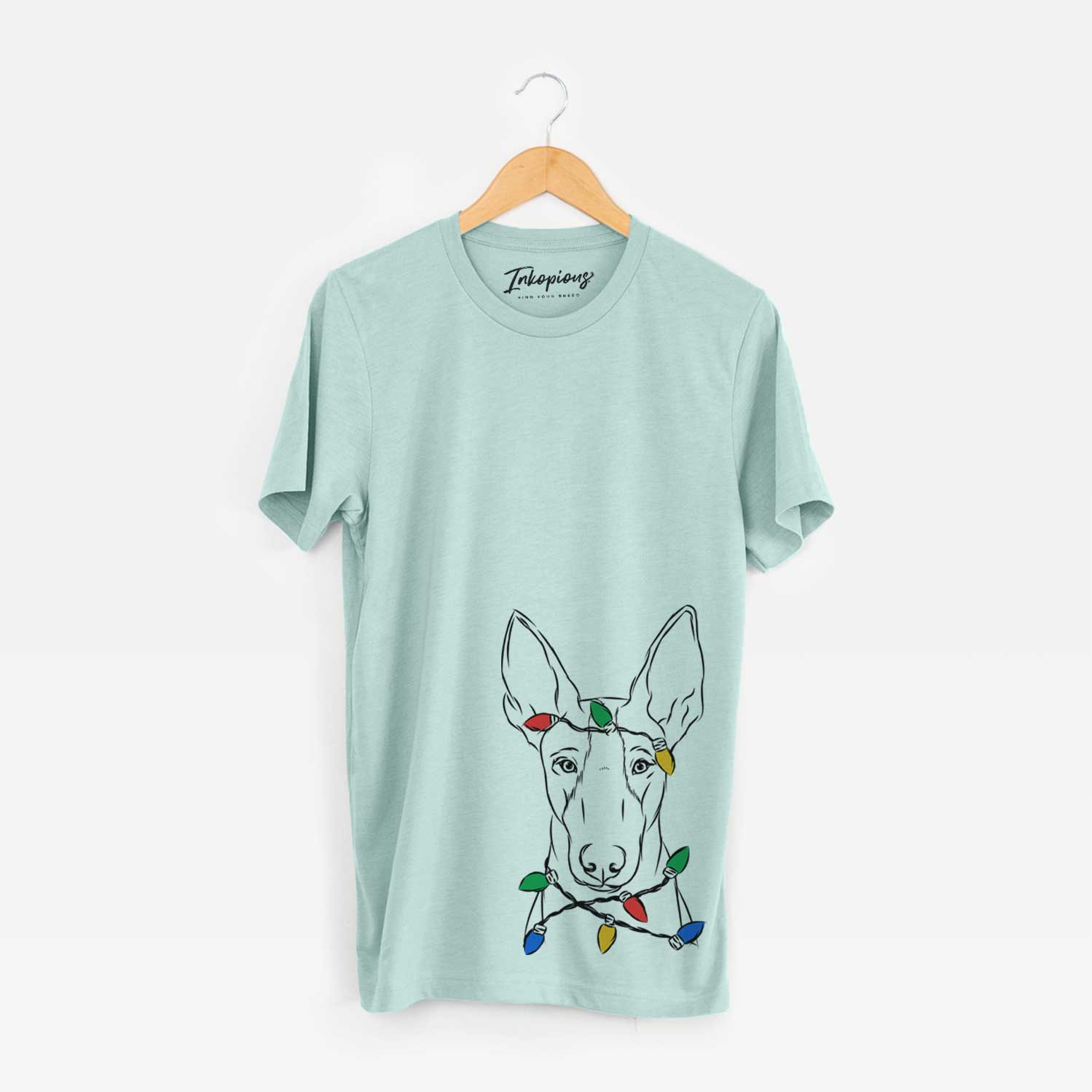 Hand-drawn sketch of Indy the Ibizan Hound wrapped in Christmas lights on a Heather Sage Unisex crewneck