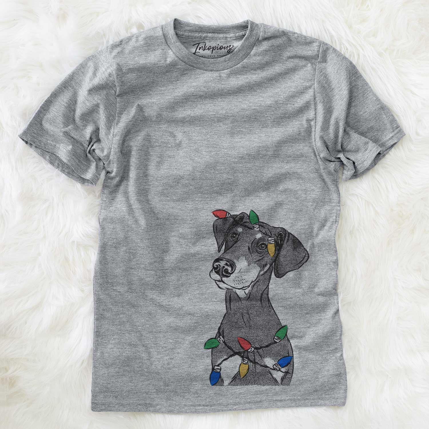 Hand-drawn sketch of Iroh the Doberman Pinscher wrapped in Christmas lights on a Grey Unisex crewneck
