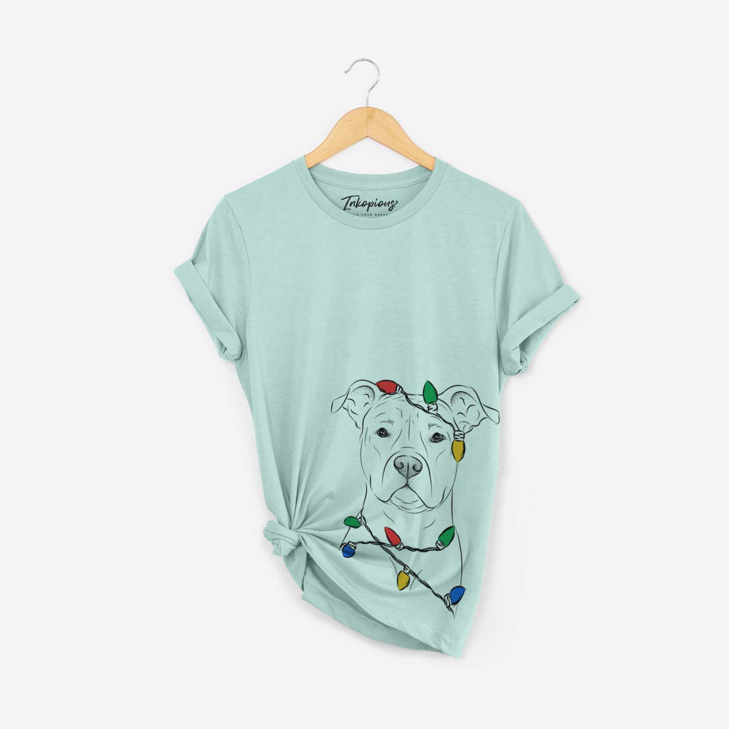 Hand-drawn sketch of Jethro the American Staffordshire Terrier wrapped in Christmas lights on a Heather Sage Unisex crewneck