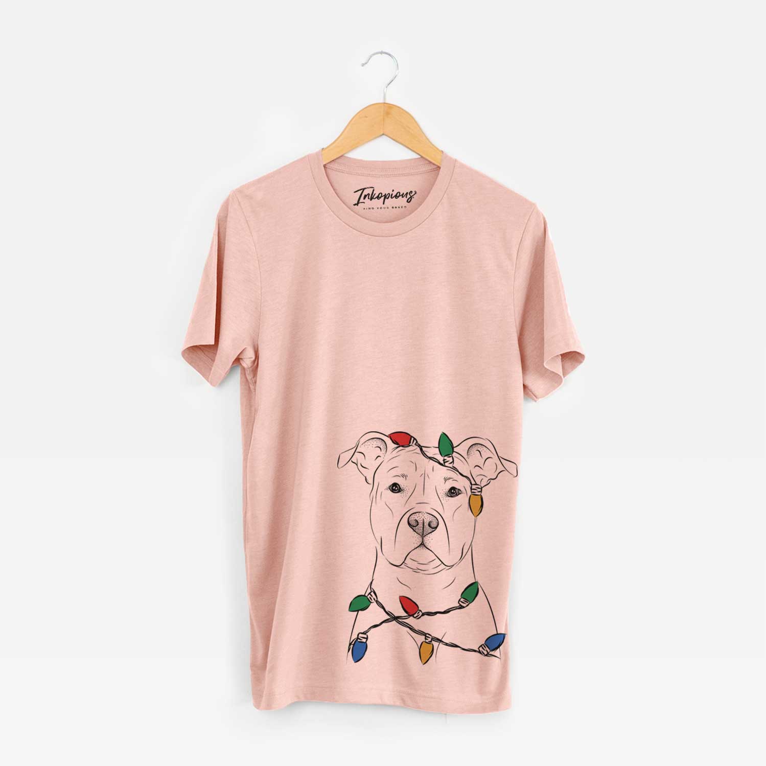 Hand-drawn sketch of Jethro the American Staffordshire Terrier wrapped in Christmas lights on a Peach Unisex crewneck