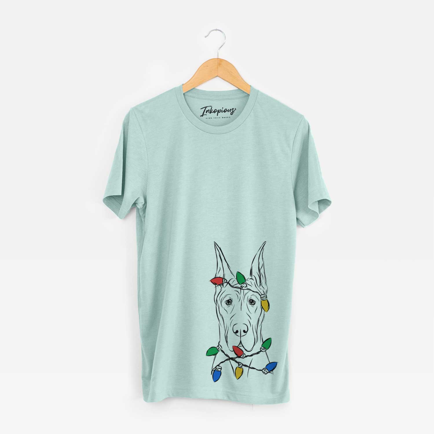 Hand-drawn sketch of Jude the Great Dane wrapped in Christmas lights on a Heather Sage Unisex crewneck
