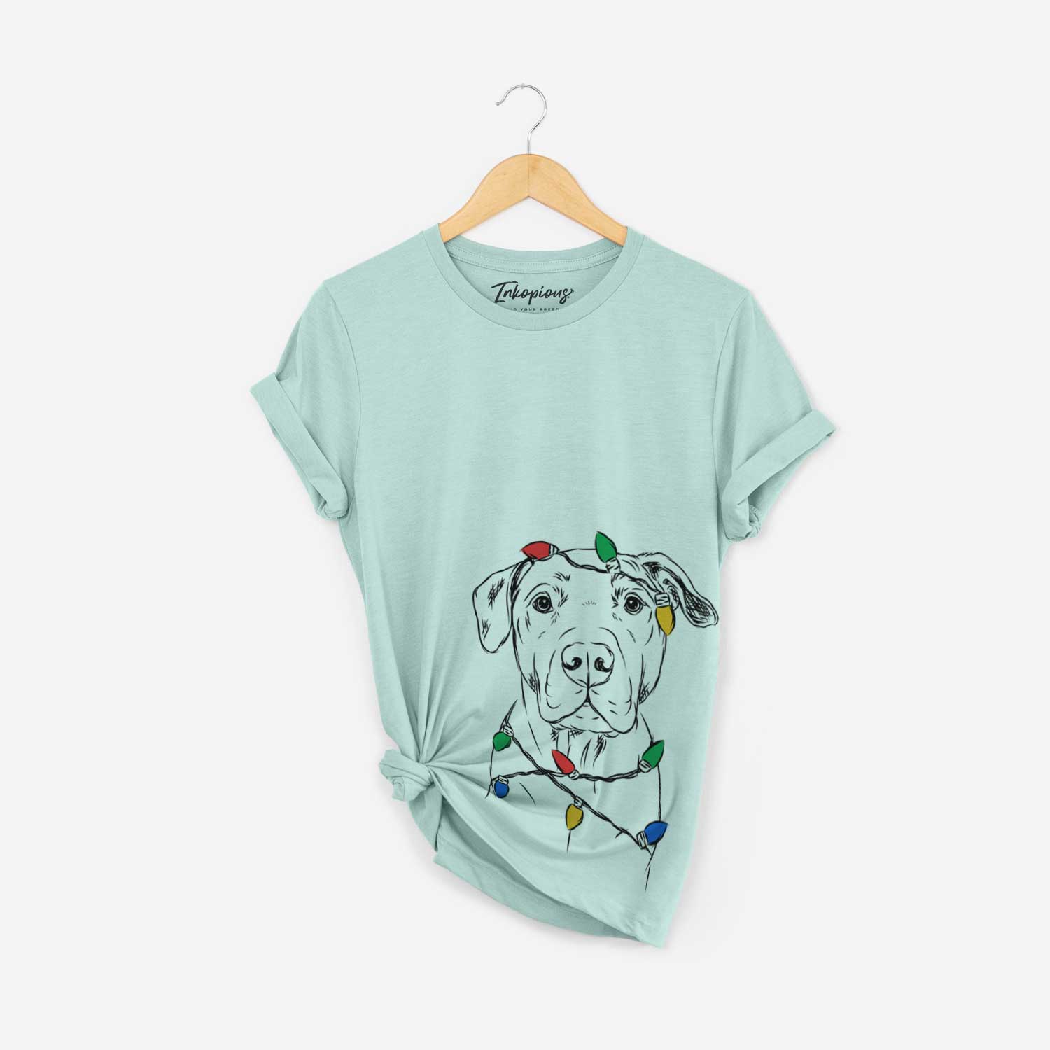 Hand-drawn sketch of Kadin the Pitbull wrapped in Christmas lights on a Heather Sage Unisex crewneck