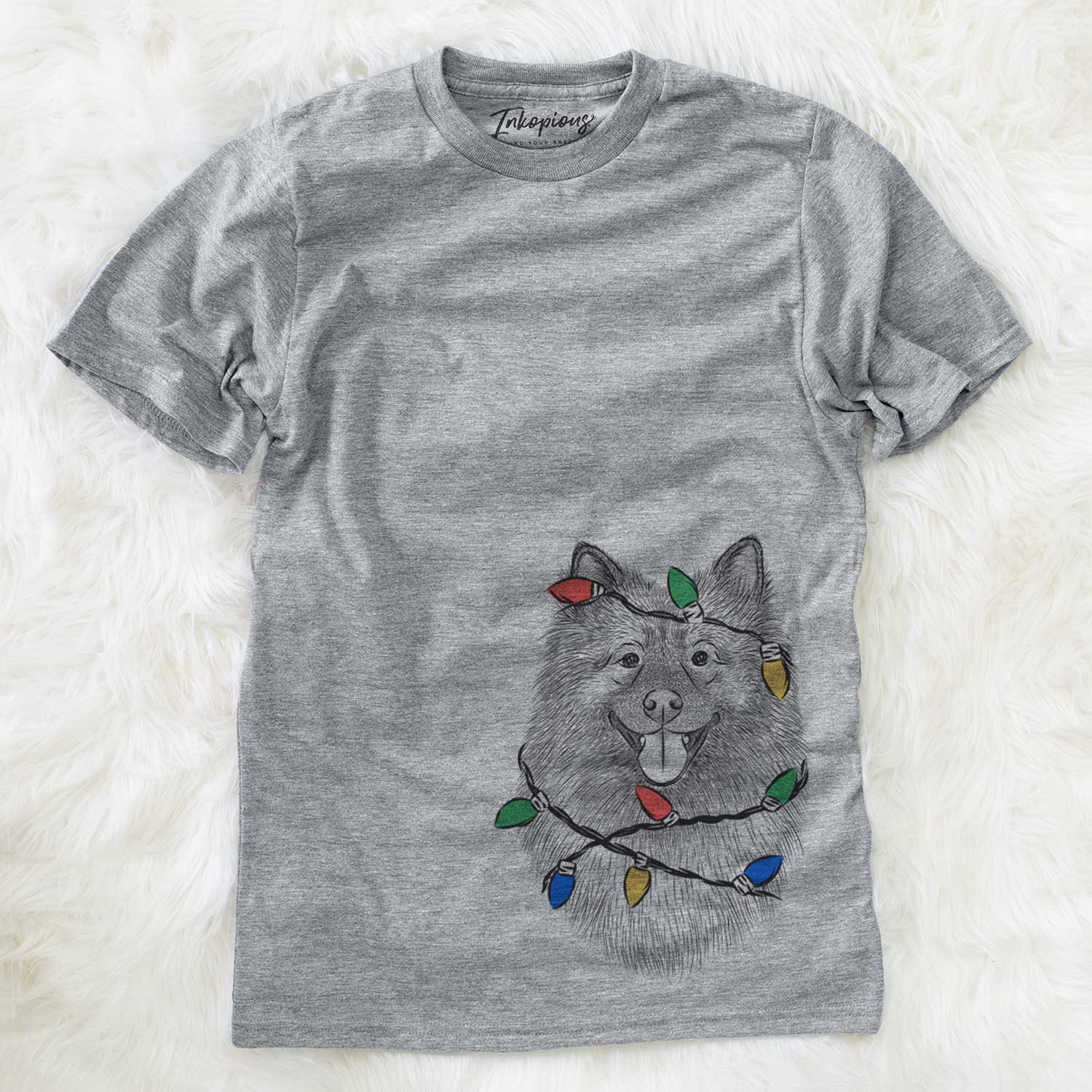Hand-drawn sketch of Kai the Keeshond wrapped in Christmas lights on a Grey Unisex crewneck