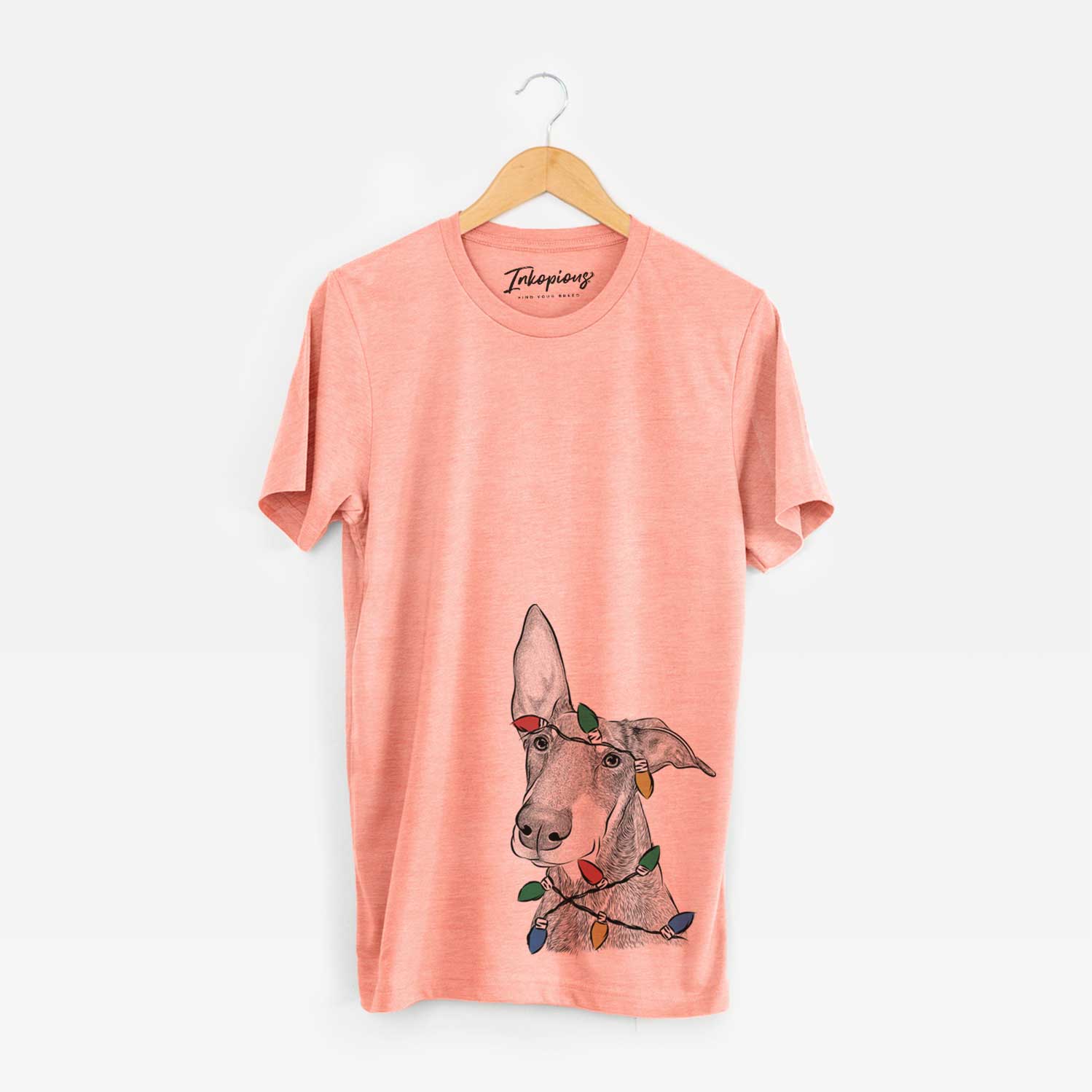 Hand-drawn sketch of Kain the Doberman Pinscher wrapped in Christmas lights on a Sunset Unisex crewneck