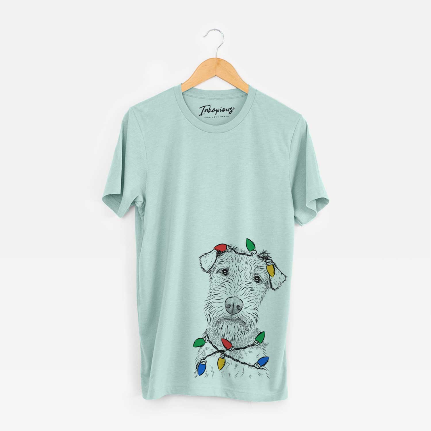 Hand-drawn sketch of Kiara the Welsh Terrier wrapped in Christmas lights on a Heather Sage Unisex crewneck