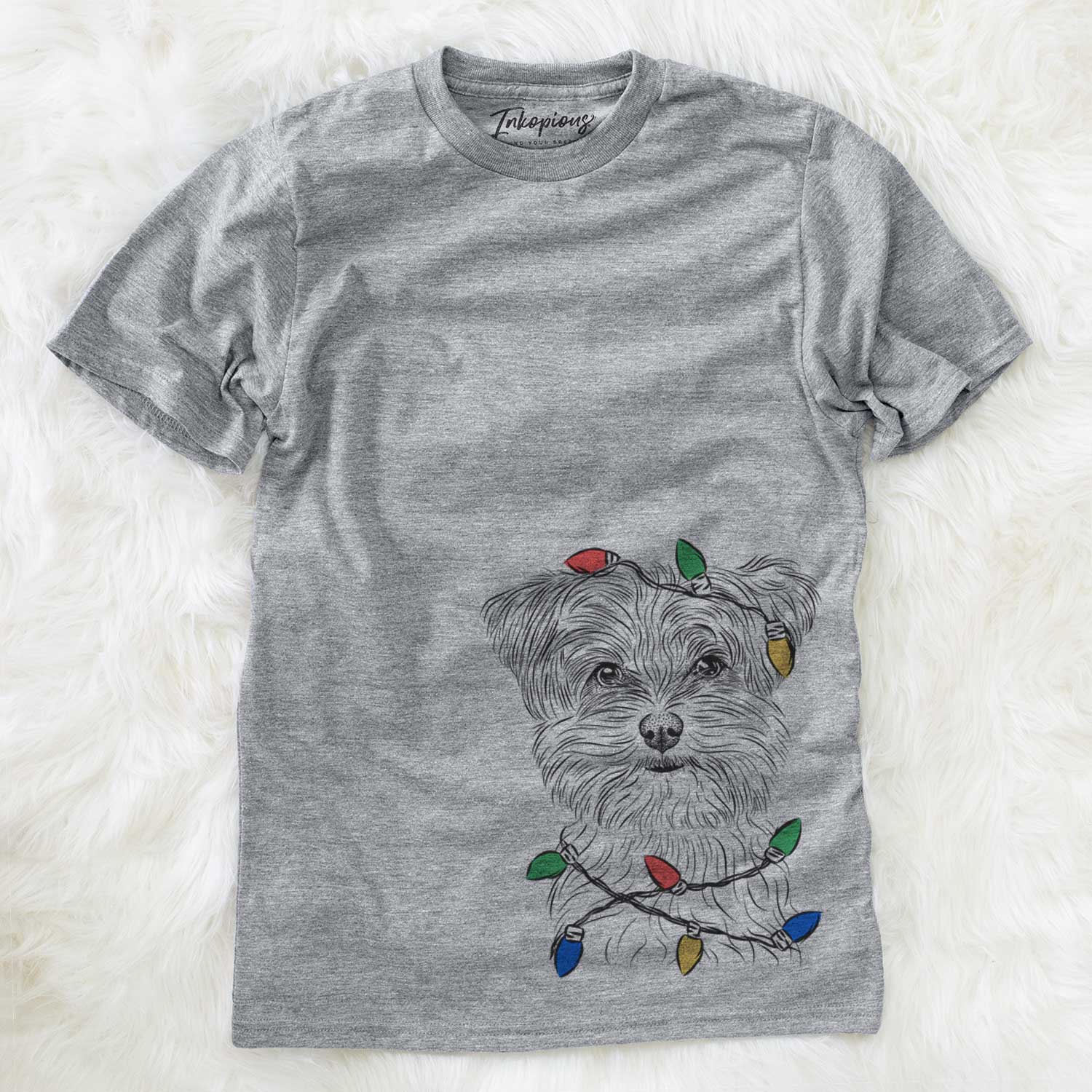 Hand-drawn sketch of Kiwi the Morkie wrapped in Christmas lights on a Grey Unisex crewneck