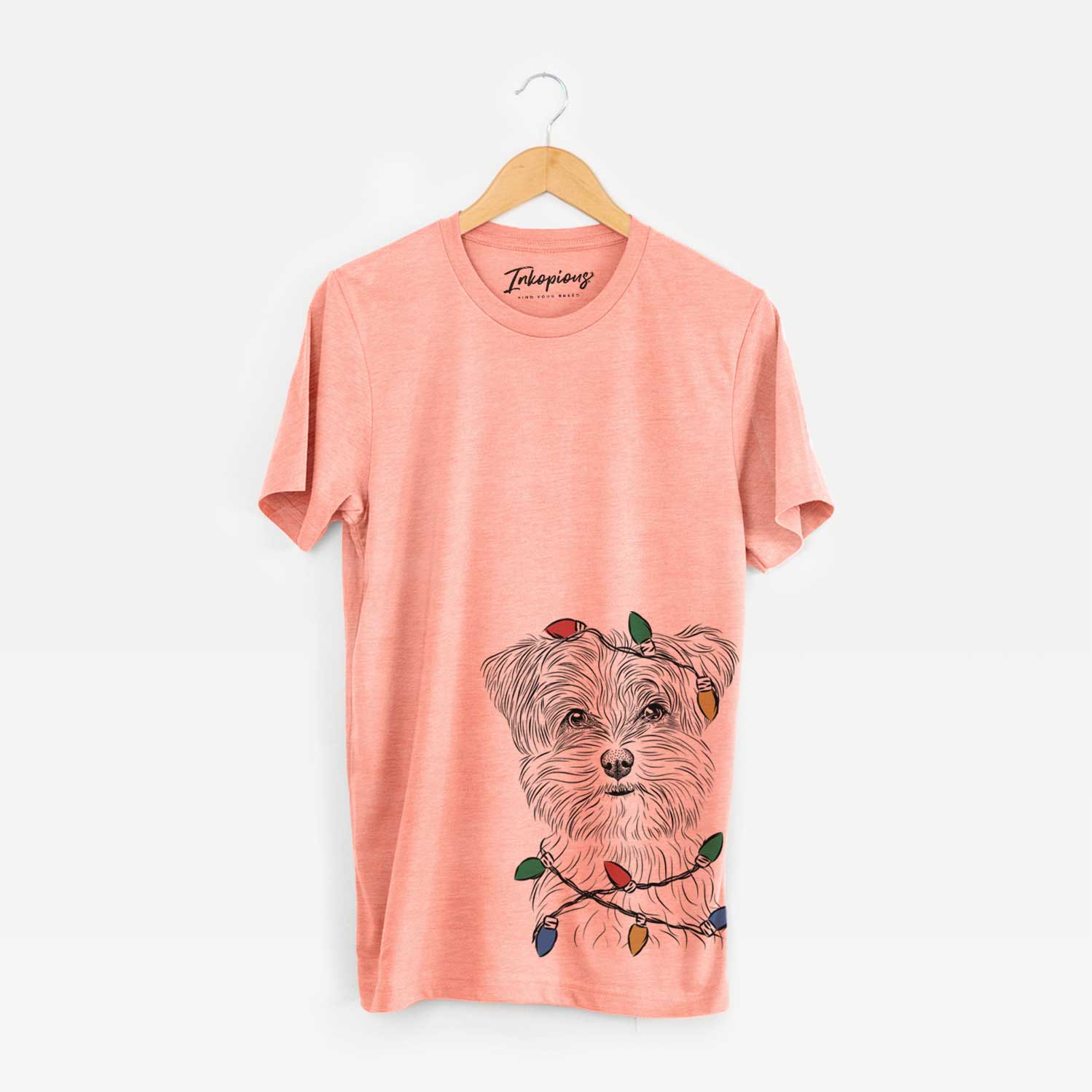 Hand-drawn sketch of Kiwi the Morkie wrapped in Christmas lights on a Sunset Unisex crewneck