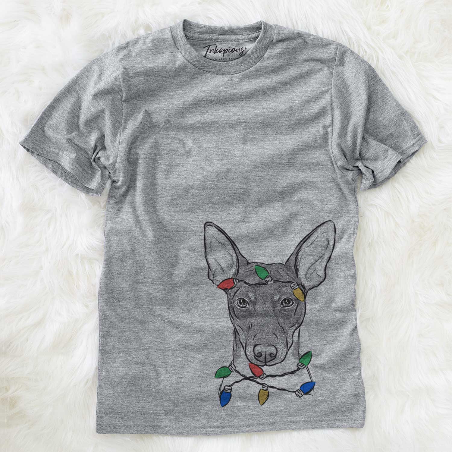 Hand-drawn sketch of Knox the Rat Terrier wrapped in Christmas lights on a Grey Unisex crewneck