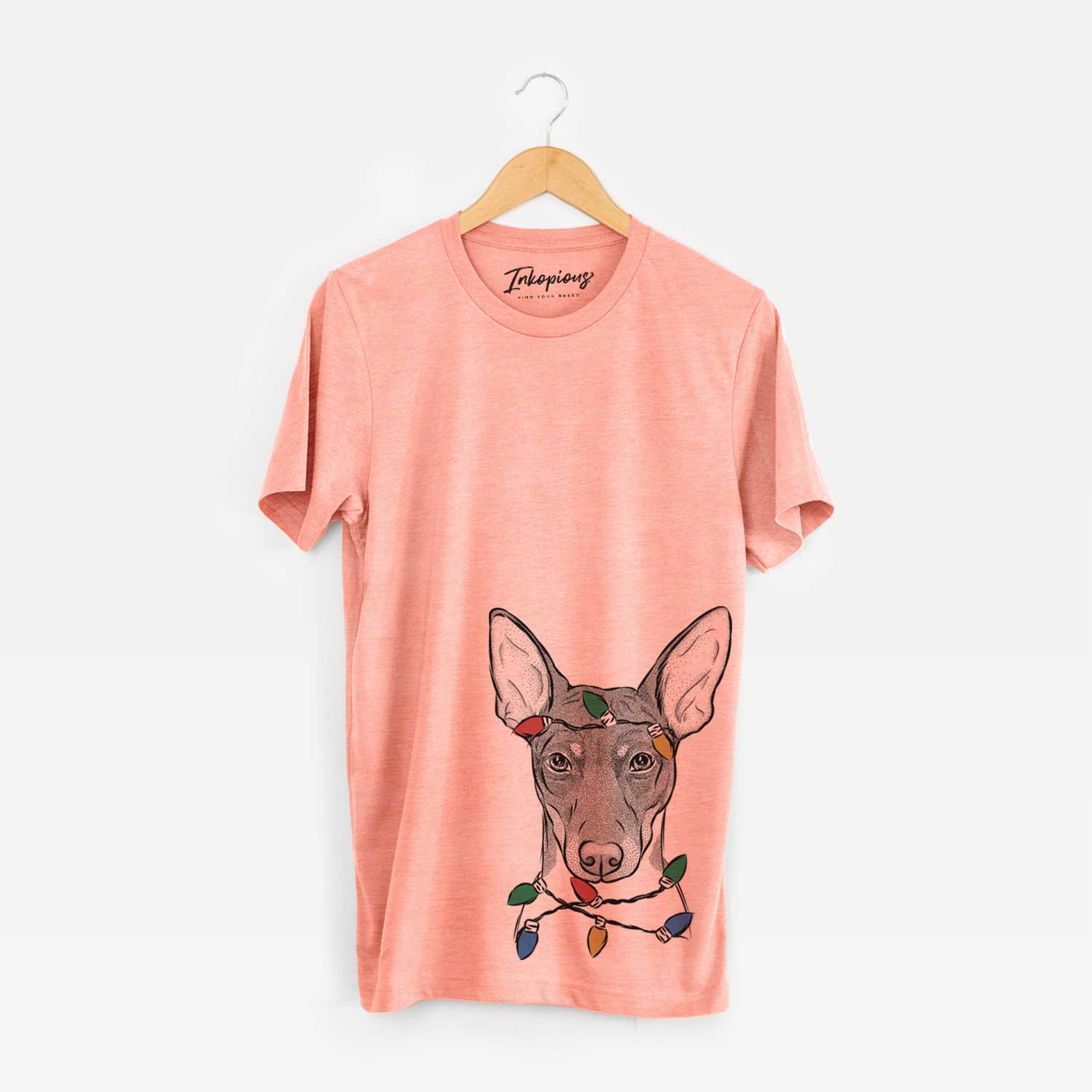 Hand-drawn sketch of Knox the Rat Terrier wrapped in Christmas lights on a Sunset Unisex crewneck