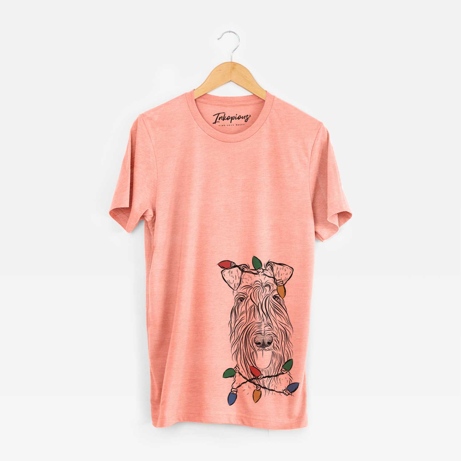 Hand-drawn sketch of Kricket the Kerry Blue Terrier wrapped in Christmas lights on a Sunset Unisex crewneck
