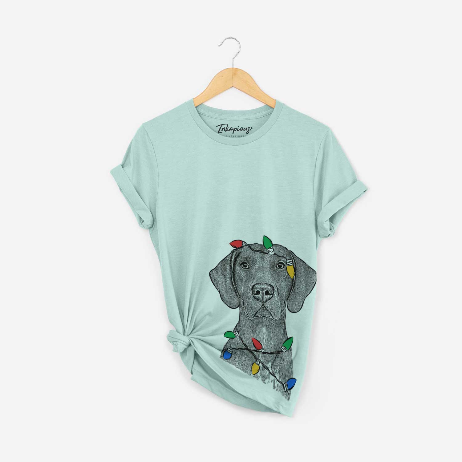 Hand-drawn sketch of Lucifer the German Shorthaired Pointer wrapped in Christmas lights on a Heather Sage Unisex crewneck