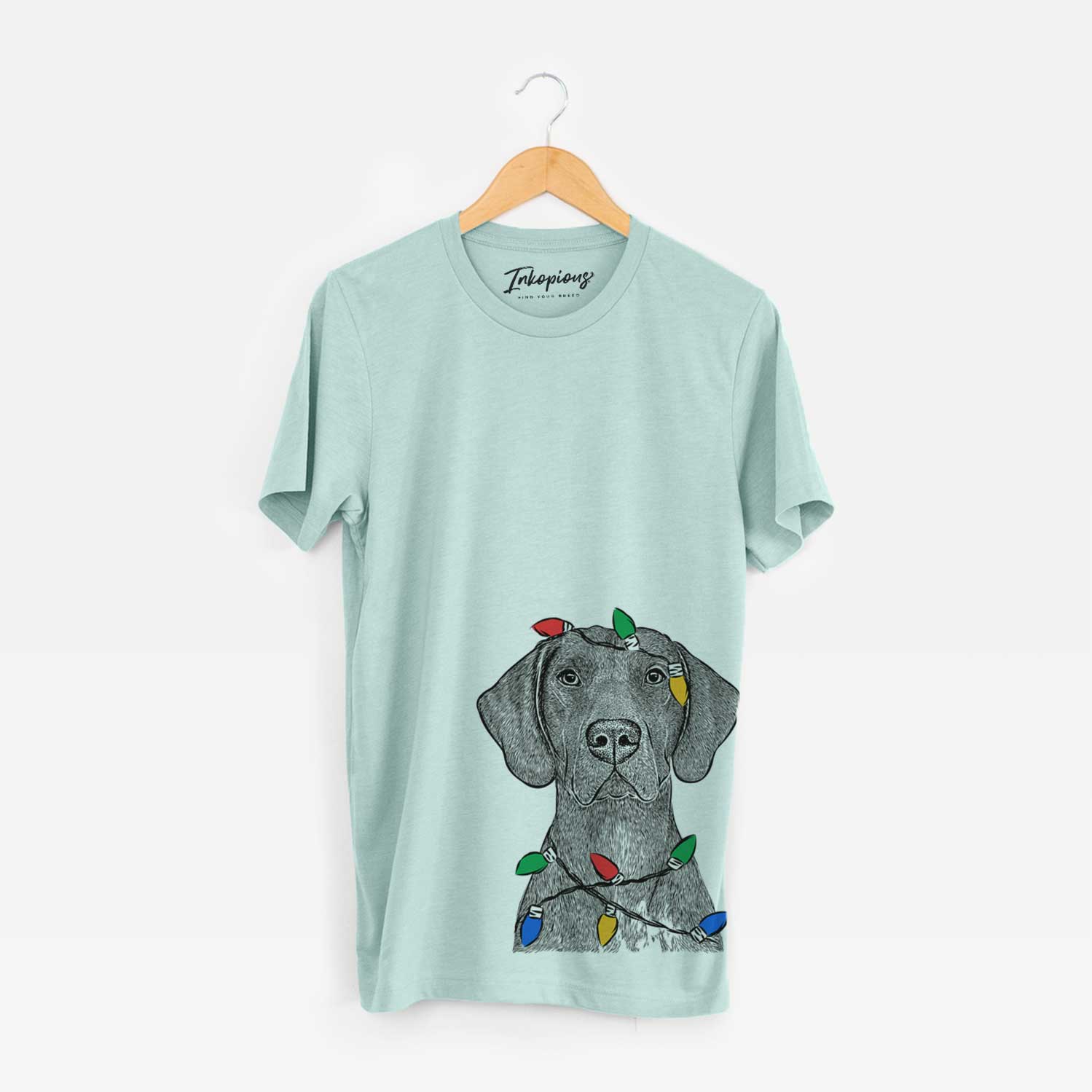 Hand-drawn sketch of Lucifer the German Shorthaired Pointer wrapped in Christmas lights on a Heather Sage Unisex crewneck