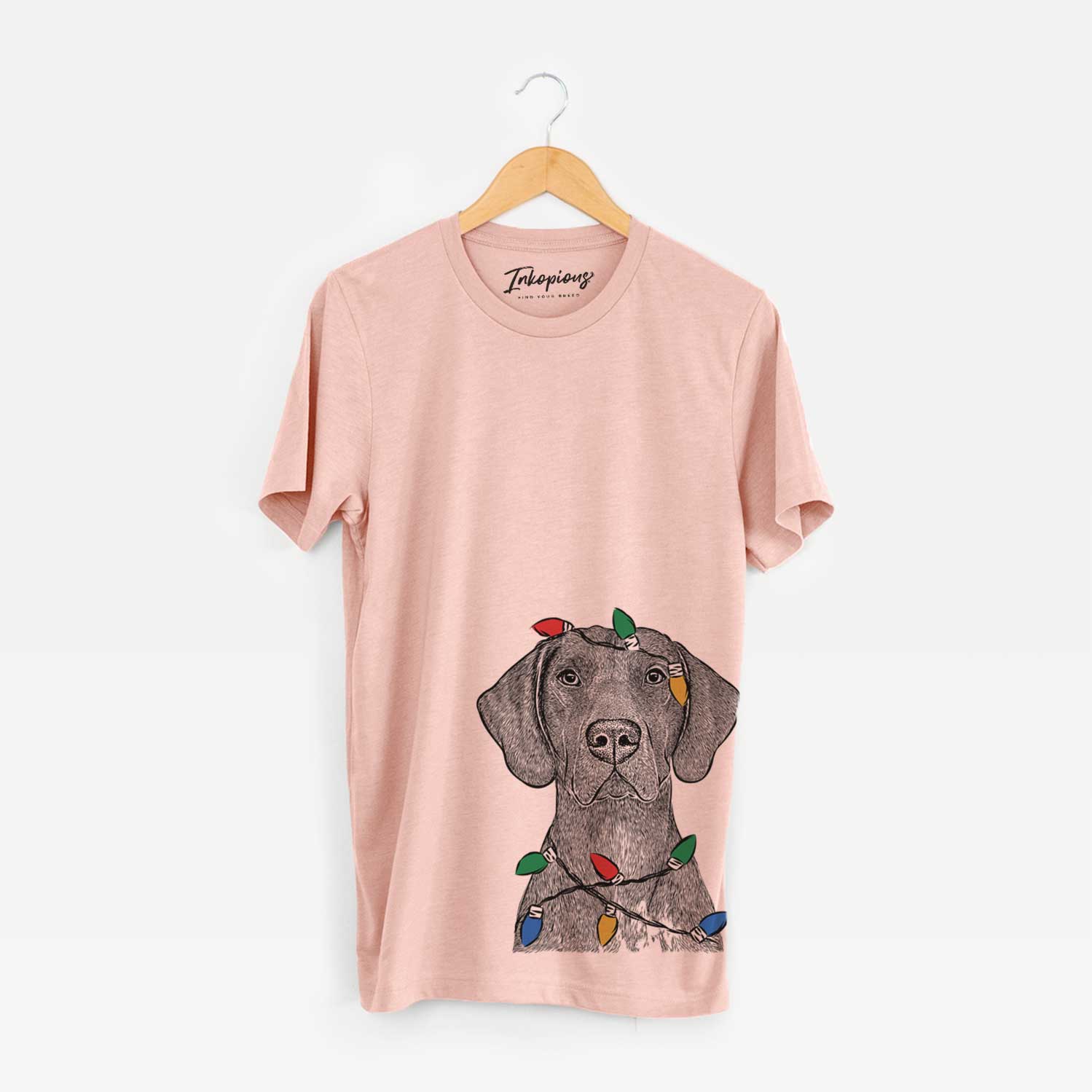 Hand-drawn sketch of Lucifer the German Shorthaired Pointer wrapped in Christmas lights on a Peach Unisex crewneck