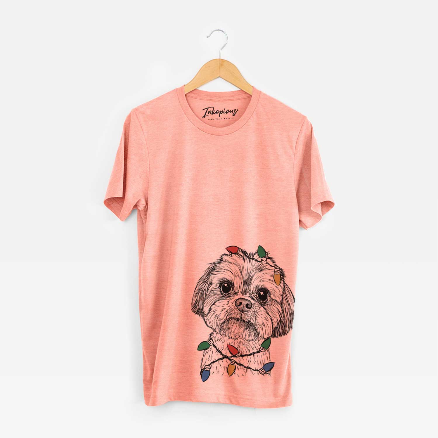 Hand-drawn sketch of Lucy the Shorkie wrapped in Christmas lights on a Sunset Unisex crewneck