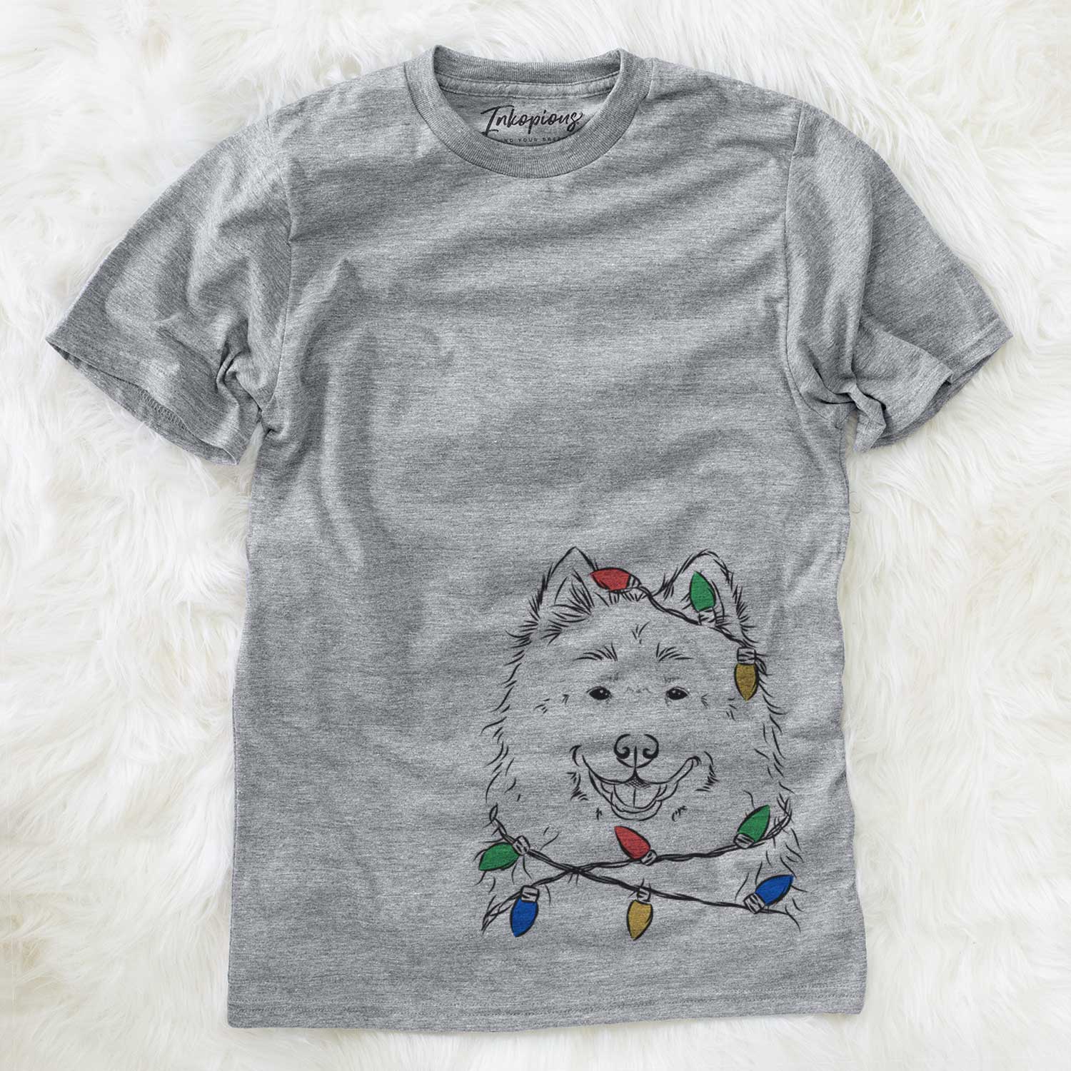 Hand-drawn sketch of Luka the Samoyed wrapped in Christmas lights on a Grey Unisex crewneck