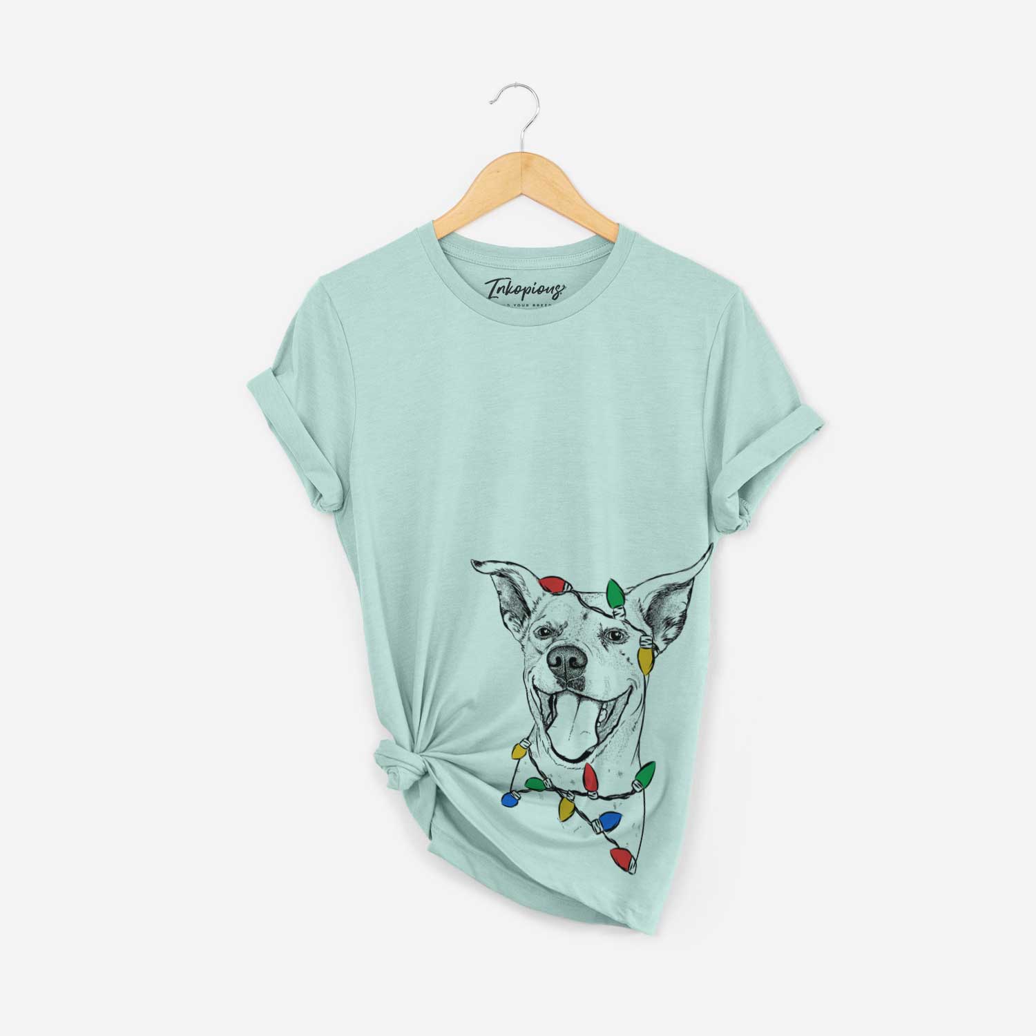 Hand-drawn sketch of Maddie the Dalmatian Pitbull Mix wrapped in Christmas lights on a Heather Sage Unisex crewneck