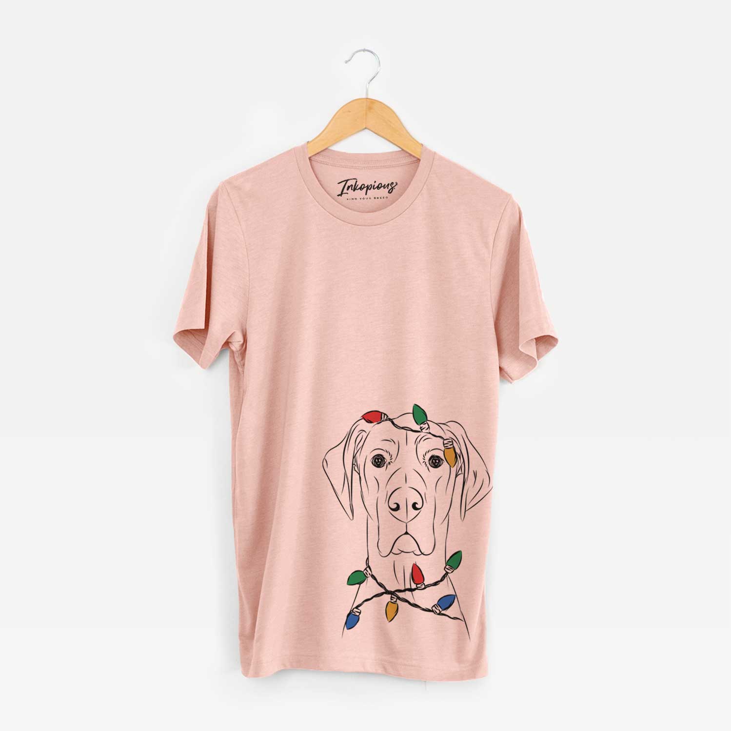 Hand-drawn sketch of Maddox the Great Dane wrapped in Christmas lights on a Peach Unisex crewneck