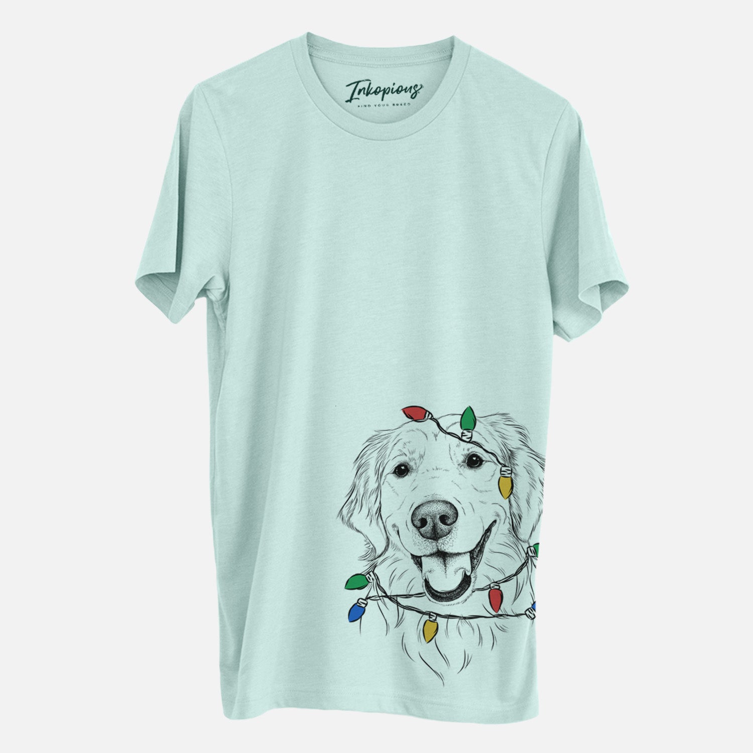 Hand-drawn sketch of Maple the Golden Retriever wrapped in Christmas lights on a Heather Sage Unisex crewneck
