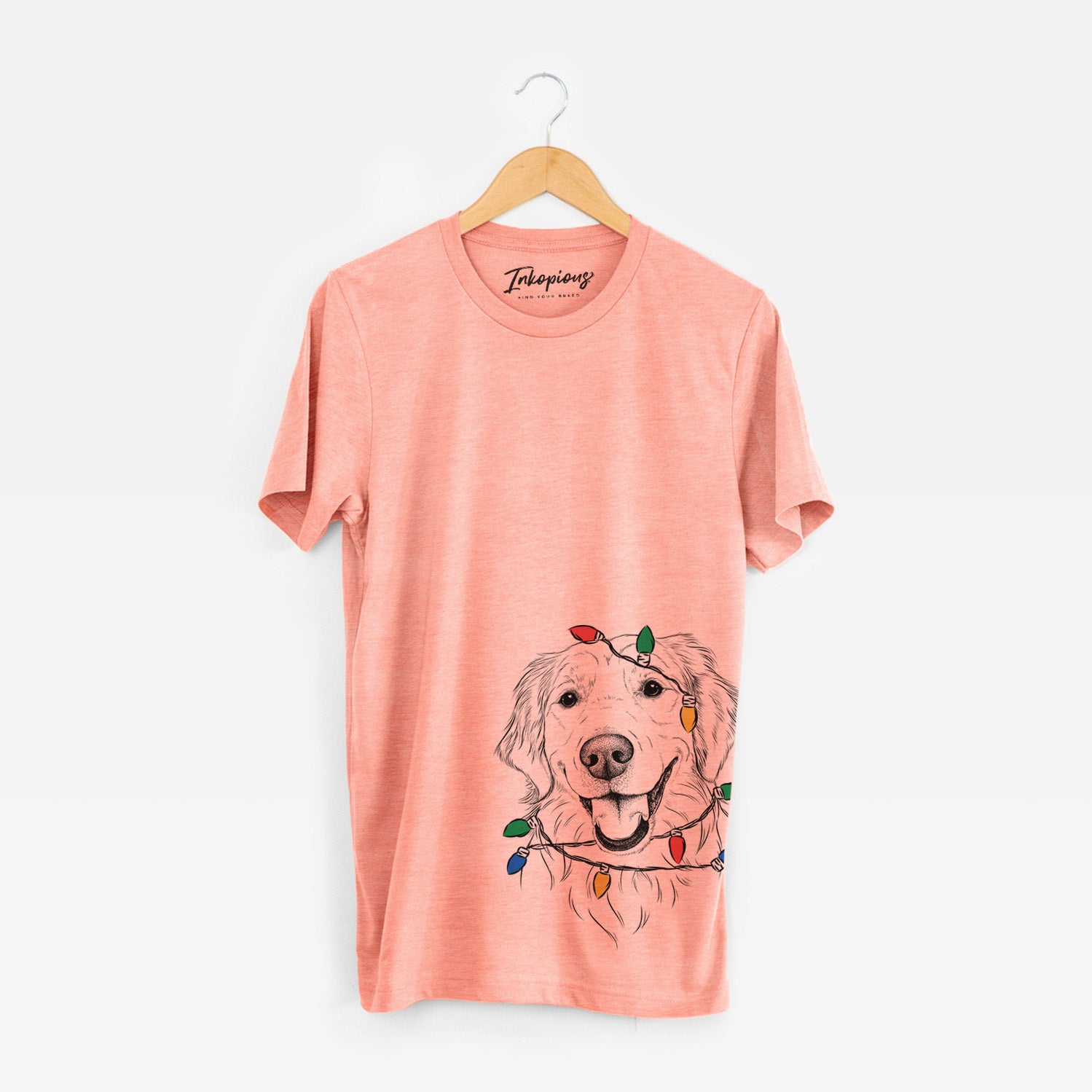 Hand-drawn sketch of Maple the Golden Retriever wrapped in Christmas lights on a Sunset Unisex crewneck