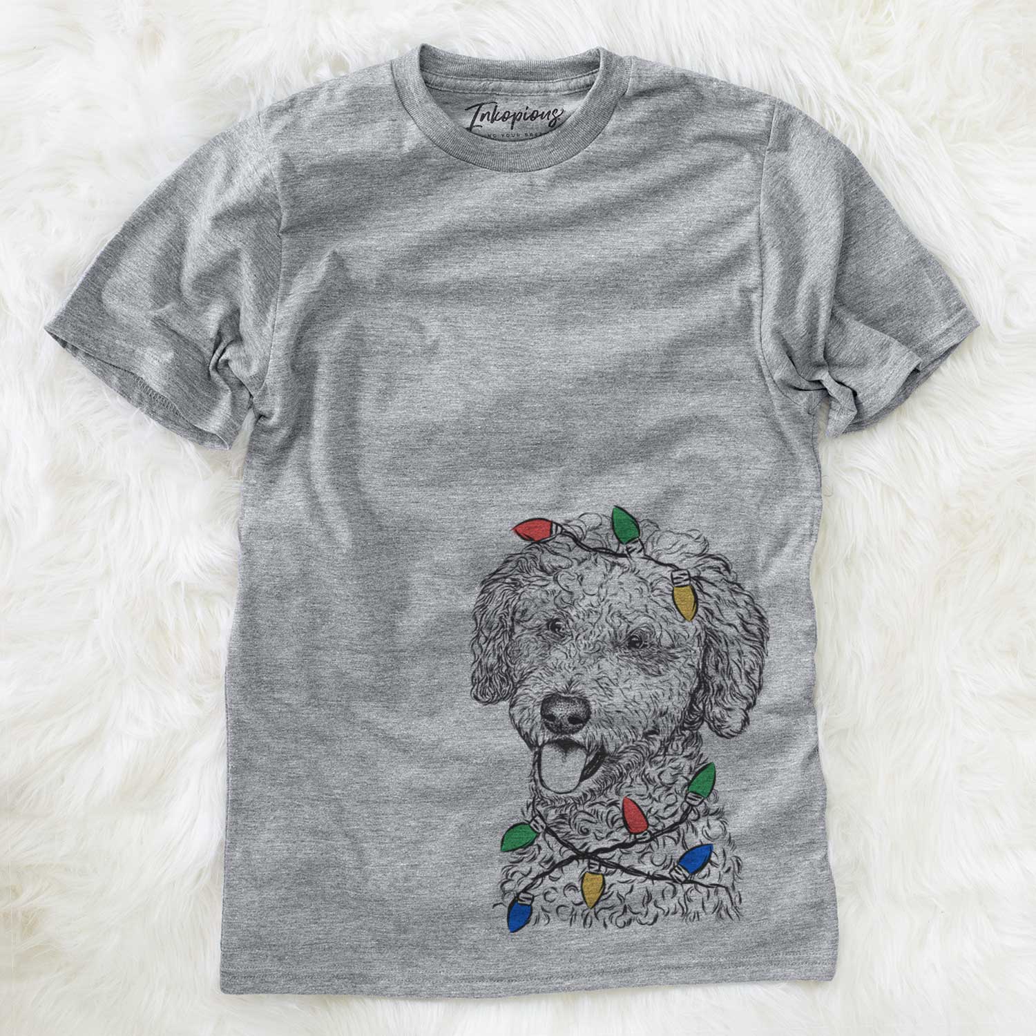Hand-drawn sketch of Marlow the Goldendoodle wrapped in Christmas lights on a Grey Unisex crewneck