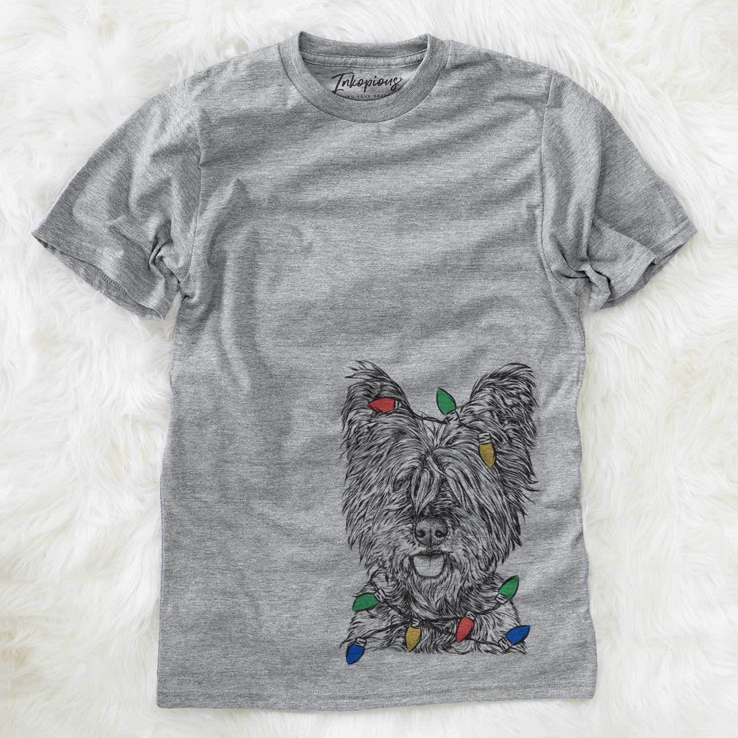 Hand-drawn sketch of McDuff the Cairn Terrier wrapped in Christmas lights on a Grey Unisex crewneck