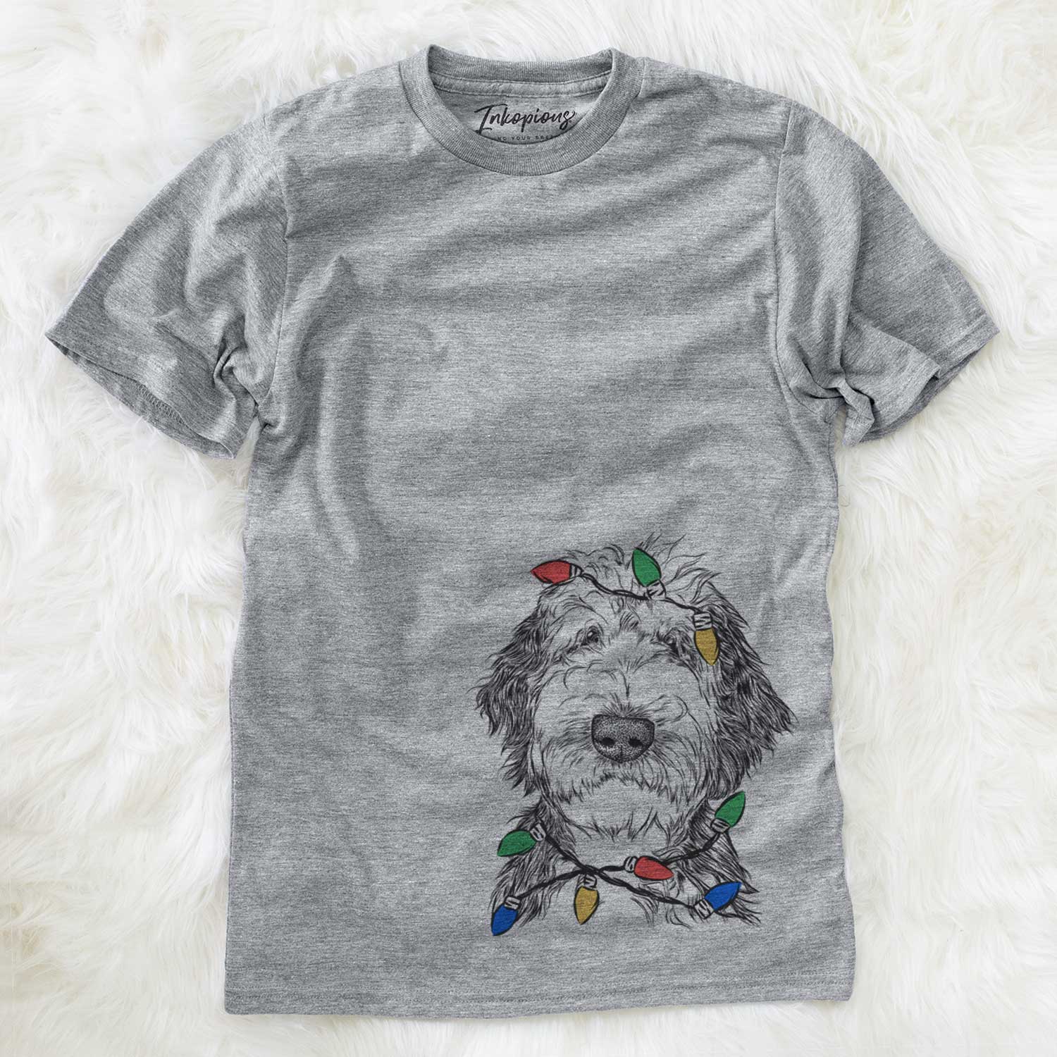 Hand-drawn sketch of Milo Fluff the Sheepadoodle wrapped in Christmas lights on a Grey Unisex crewneck