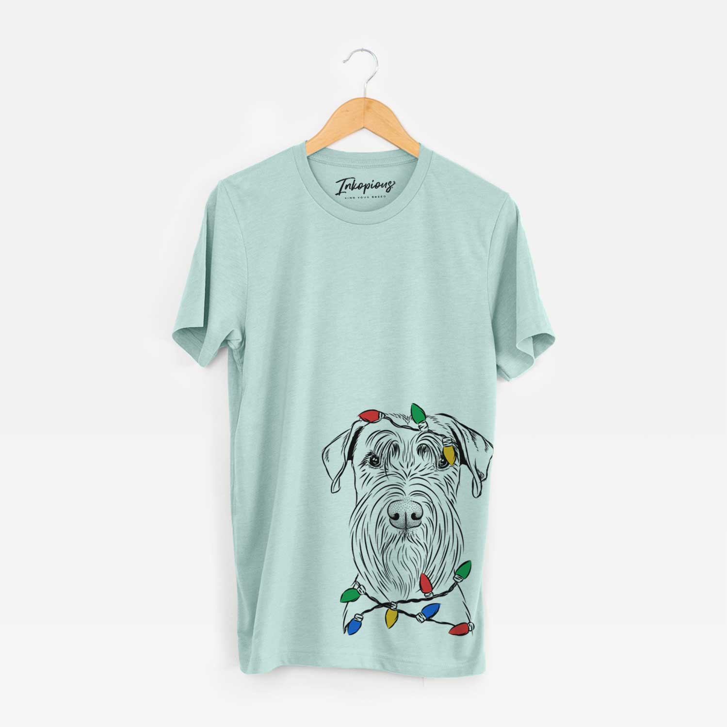 Hand-drawn sketch of Milton the Schnauzer wrapped in Christmas lights on a Heather Sage Unisex crewneck