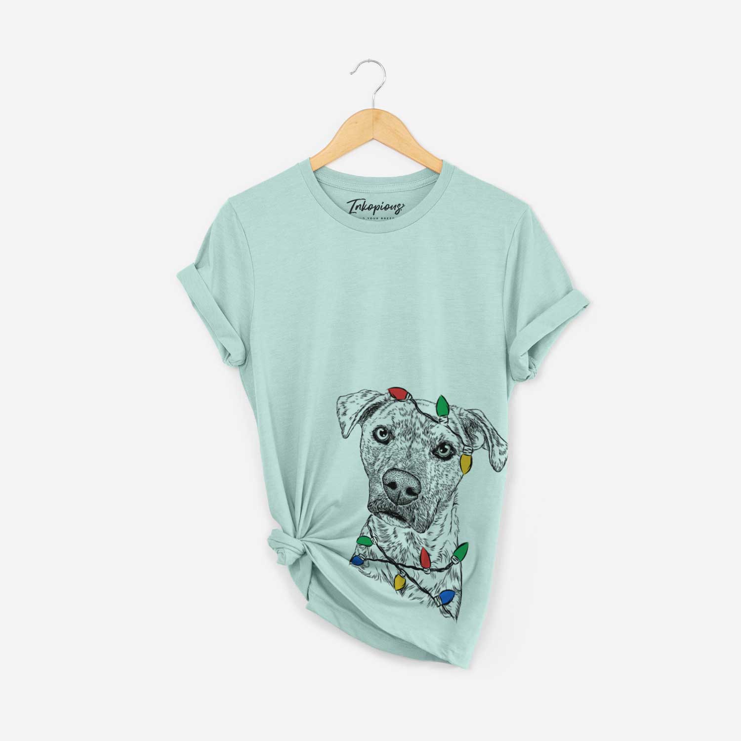 Hand-drawn sketch of Monster Baby the Pitbull Mix wrapped in Christmas lights on a Heather Sage Unisex crewneck