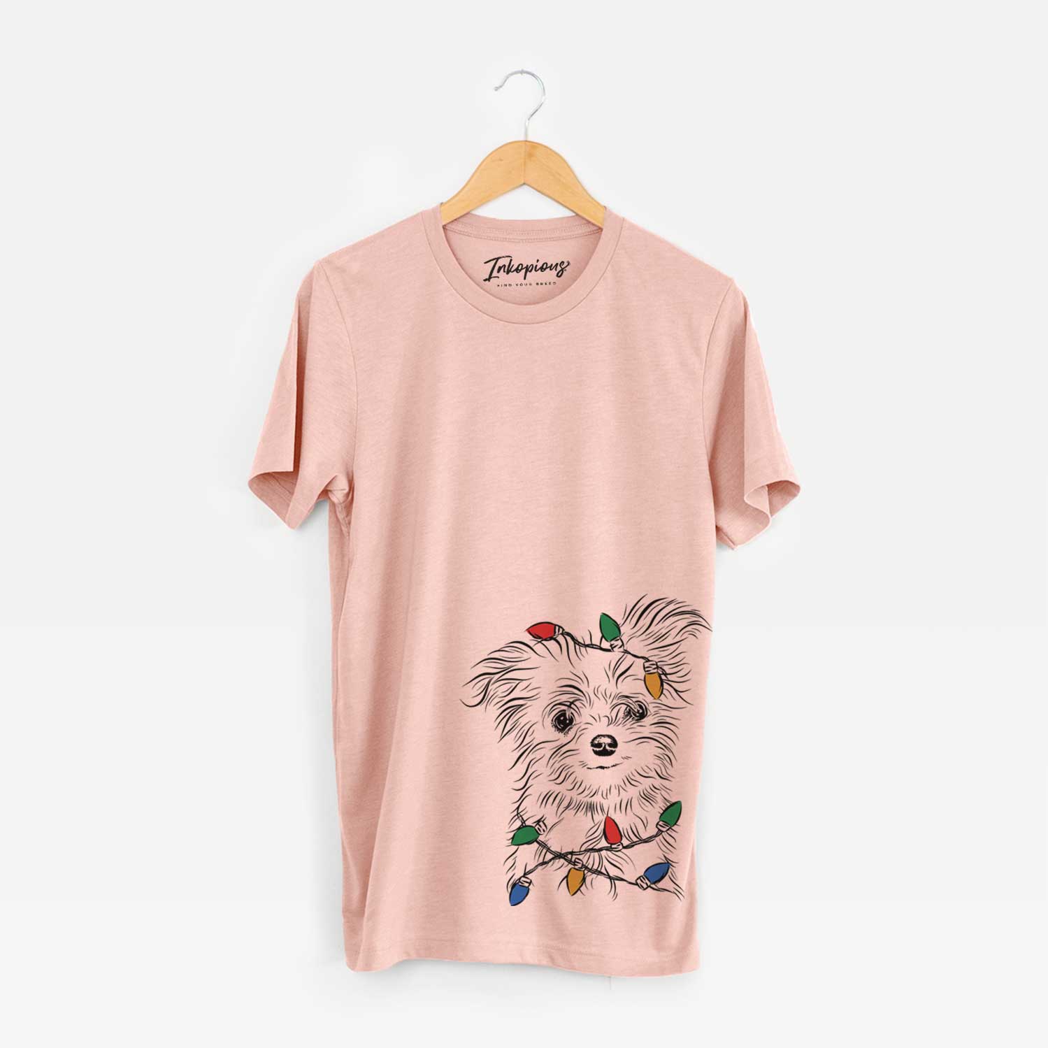 Hand-drawn sketch of Mr. Gucci Poochi the Maltese wrapped in Christmas lights on a Peach Unisex crewneck