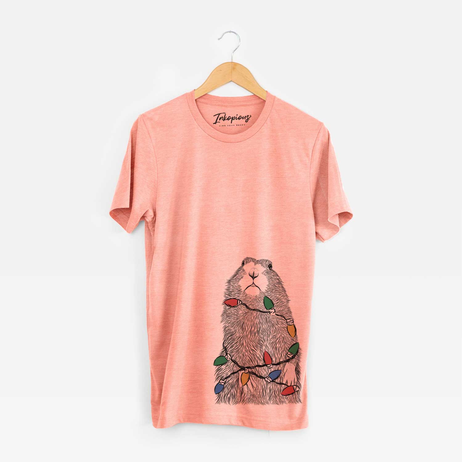 Hand-drawn sketch of Mr. Otis the Prairie Dog wrapped in Christmas lights on a Sunset Unisex crewneck