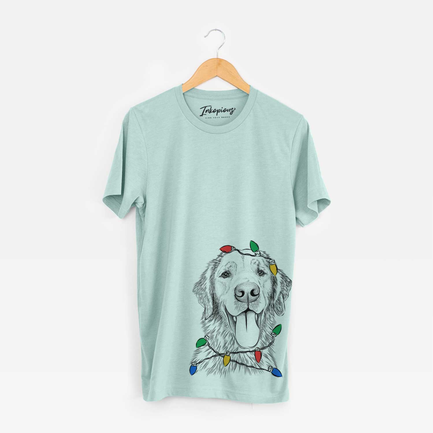 Hand-drawn sketch of Oliver Tredup the Golden Retriever wrapped in Christmas lights on a Heather Sage Unisex crewneck