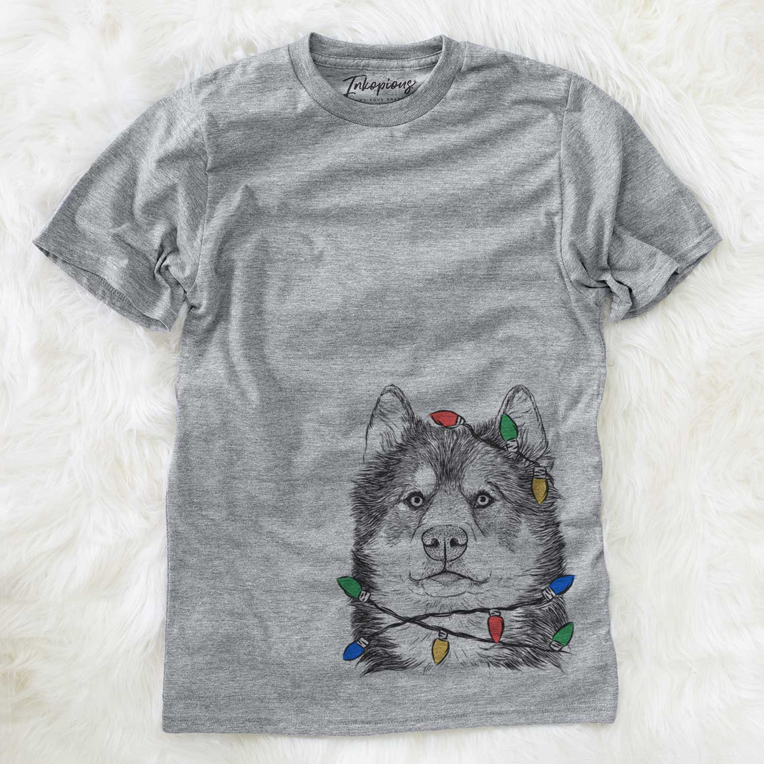 Hand-drawn sketch of Oskar the Canadian Eskimo Dog wrapped in Christmas lights on a Grey Unisex crewneck